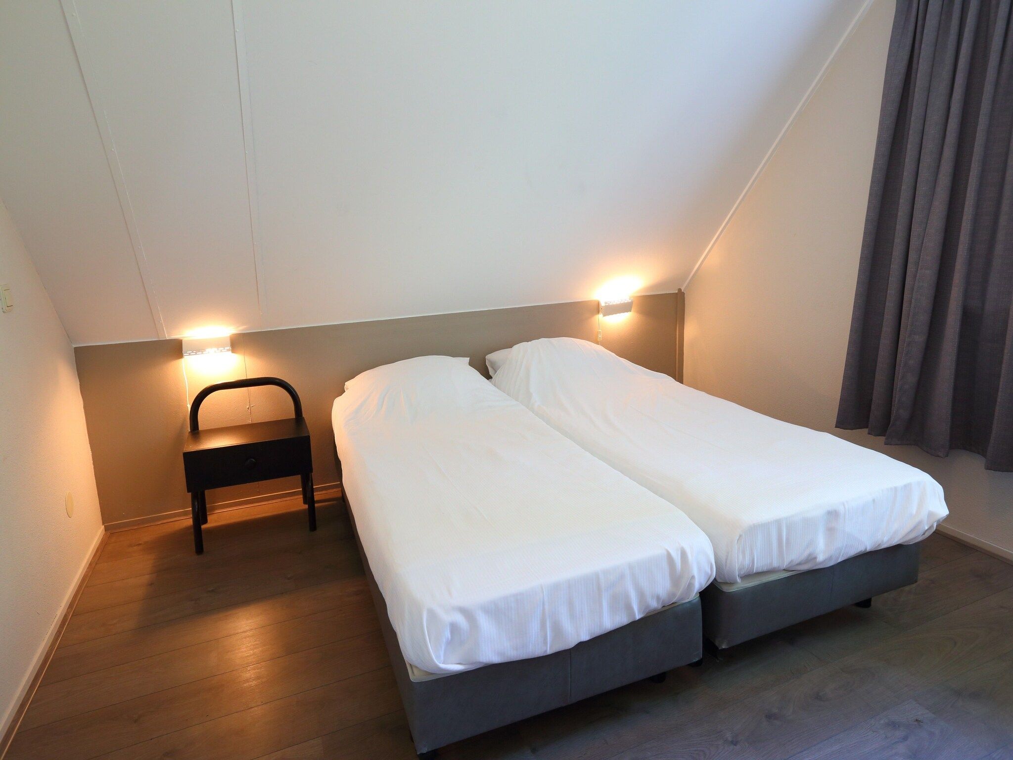 Een slaapkamer van Vakantiepark Emslandermeer 13 in Vlagtwedde