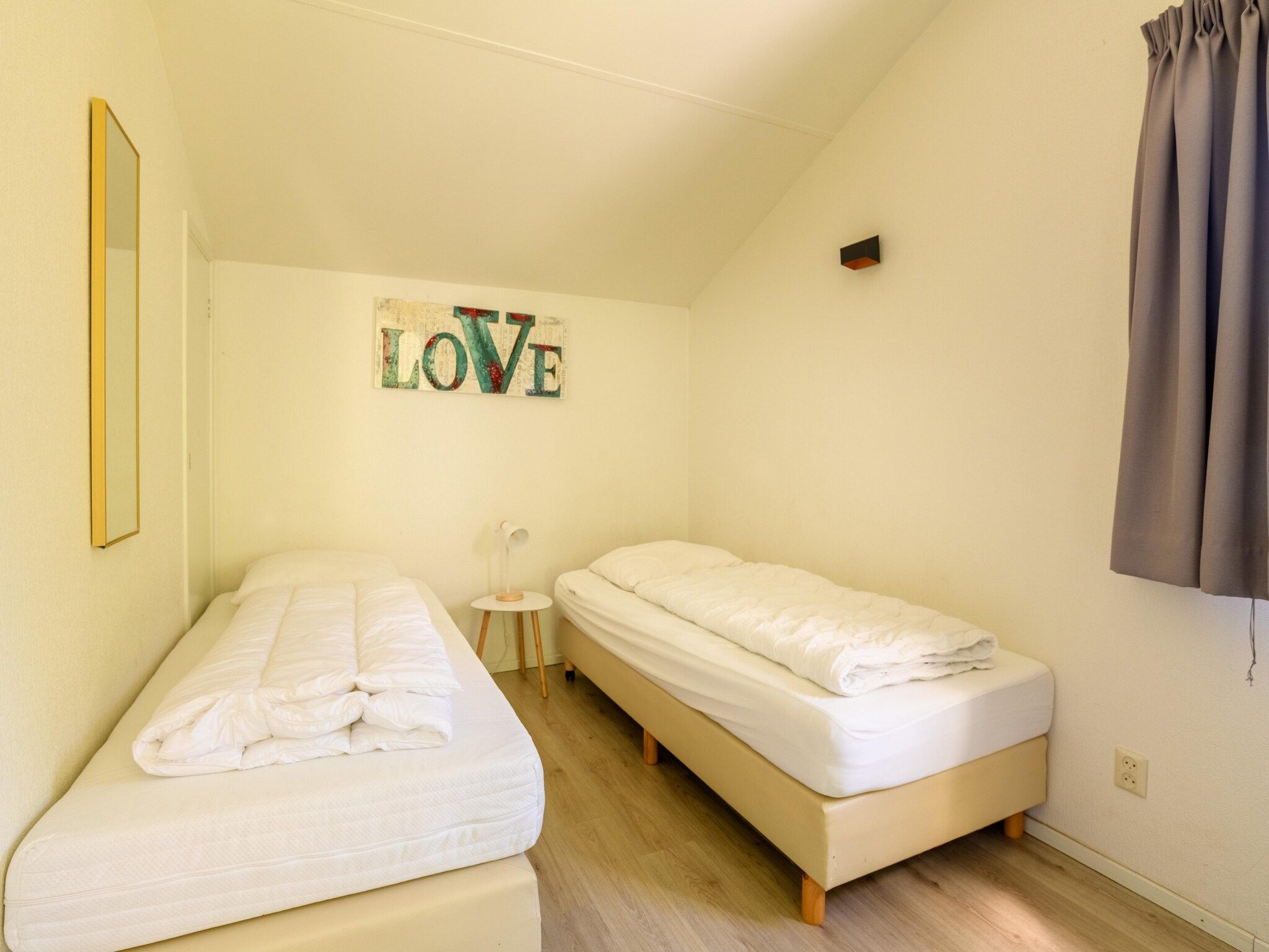 Een slaapkamer van Vakantiepark Emslandermeer 13 in Vlagtwedde