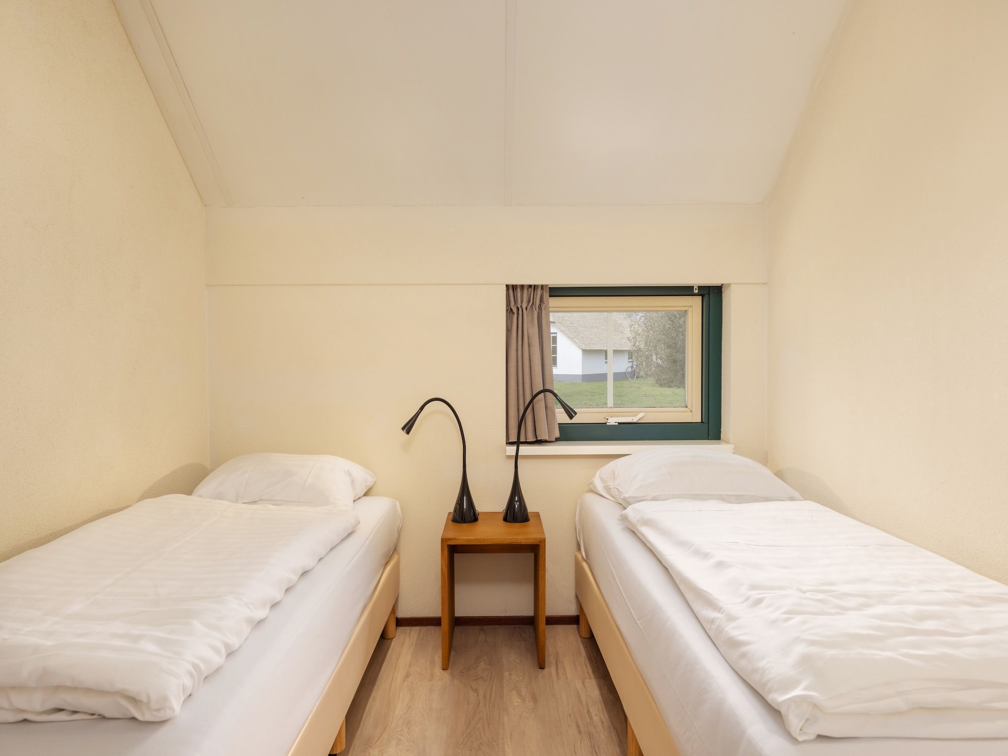 Een slaapkamer van De Veluwse Hoevegaerde 4 in Putten