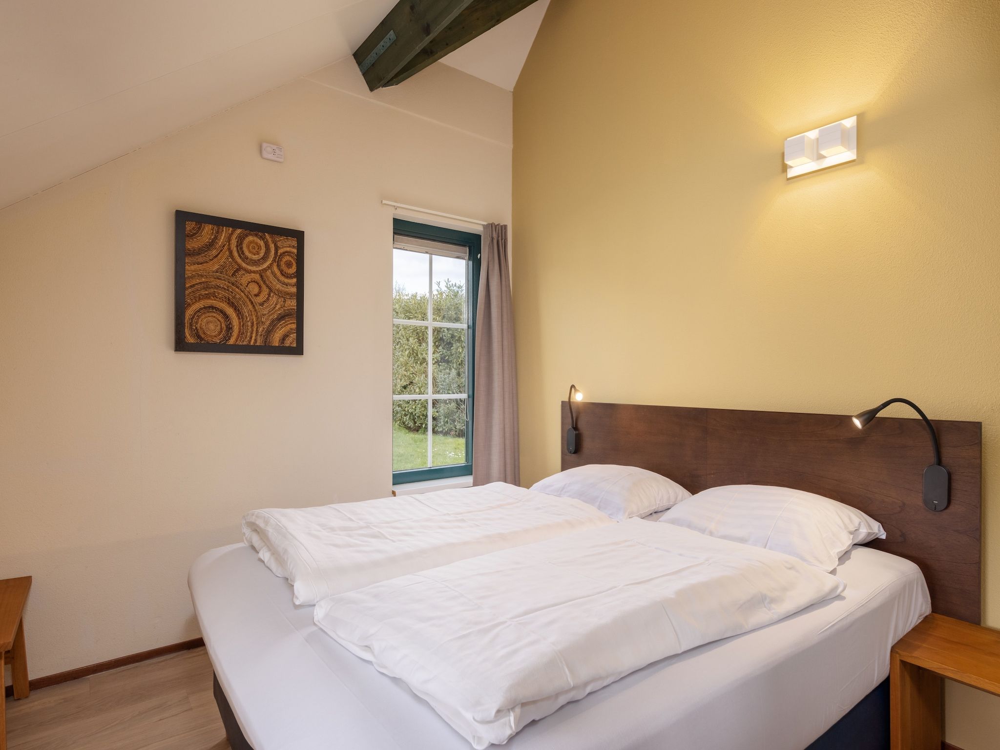 Een slaapkamer van De Veluwse Hoevegaerde 4 in Putten