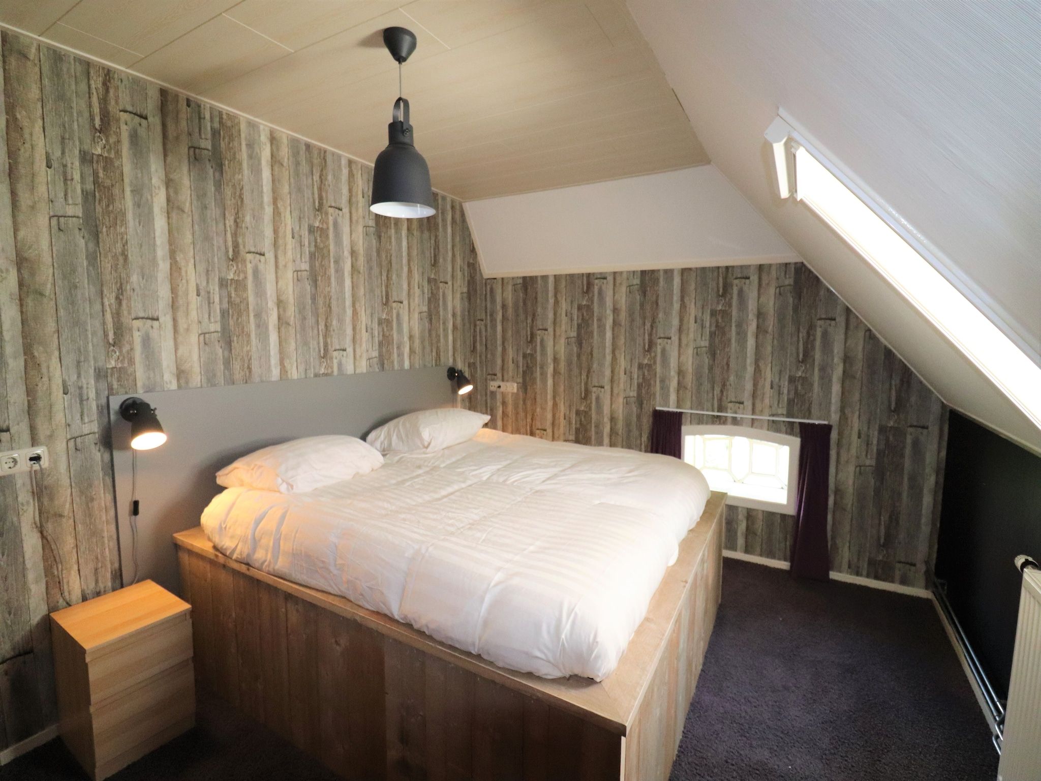 Een slaapkamer van Woonboerderij Bij Erve Mulder in Dalerveen