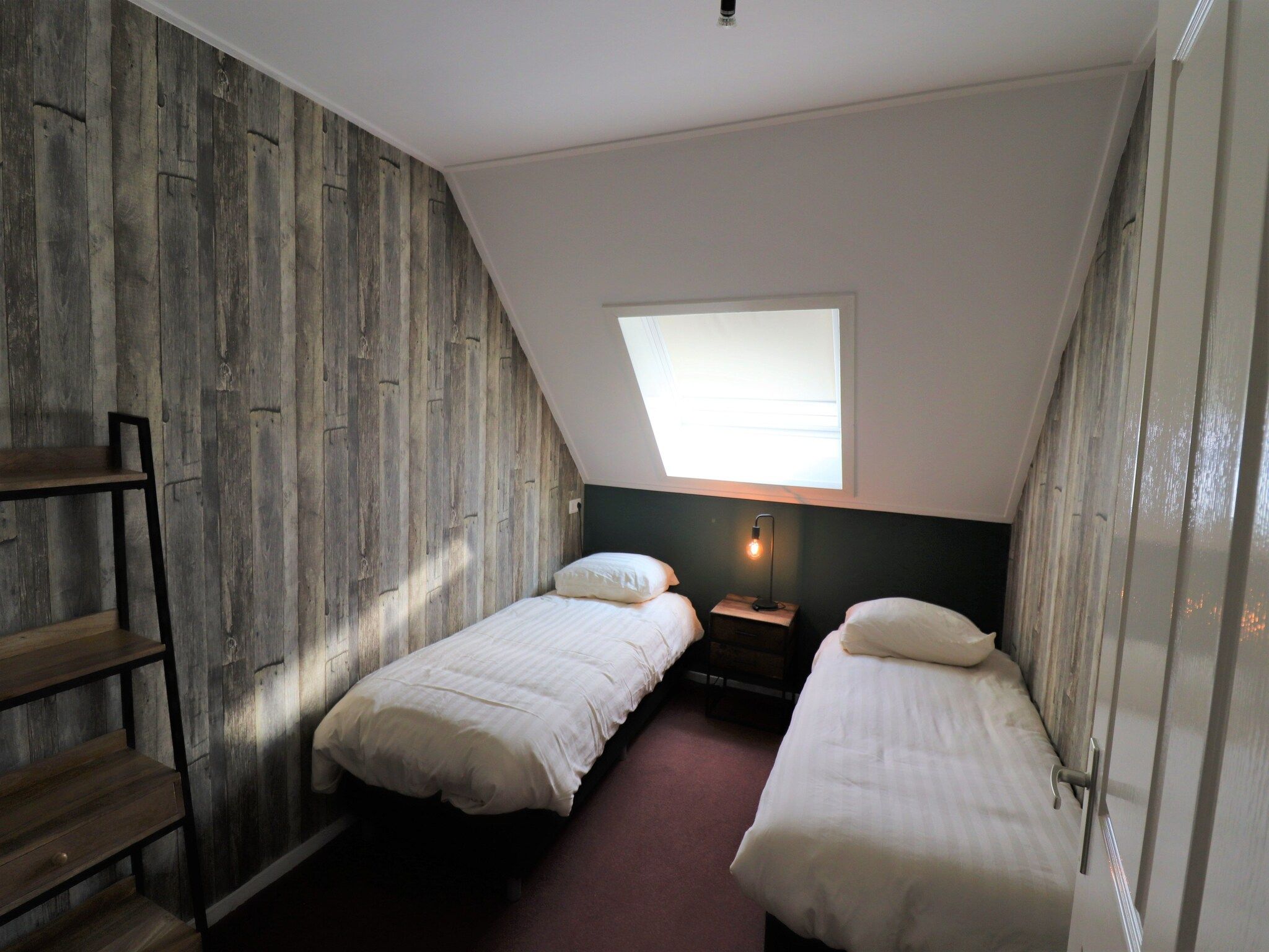 Een slaapkamer van Woonboerderij Bij Erve Mulder in Dalerveen