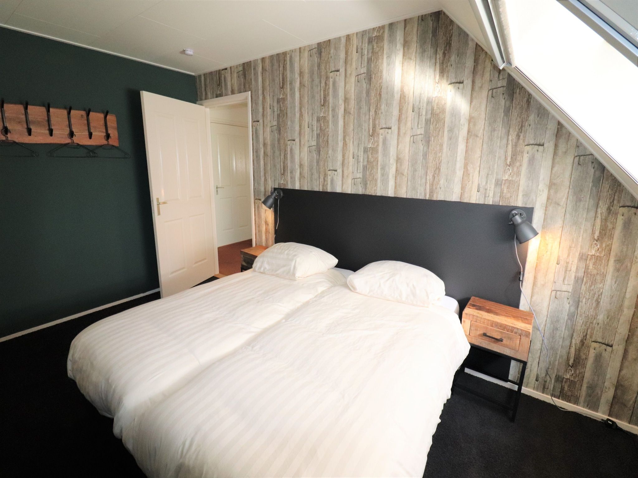 Een slaapkamer van Woonboerderij Bij Erve Mulder in Dalerveen