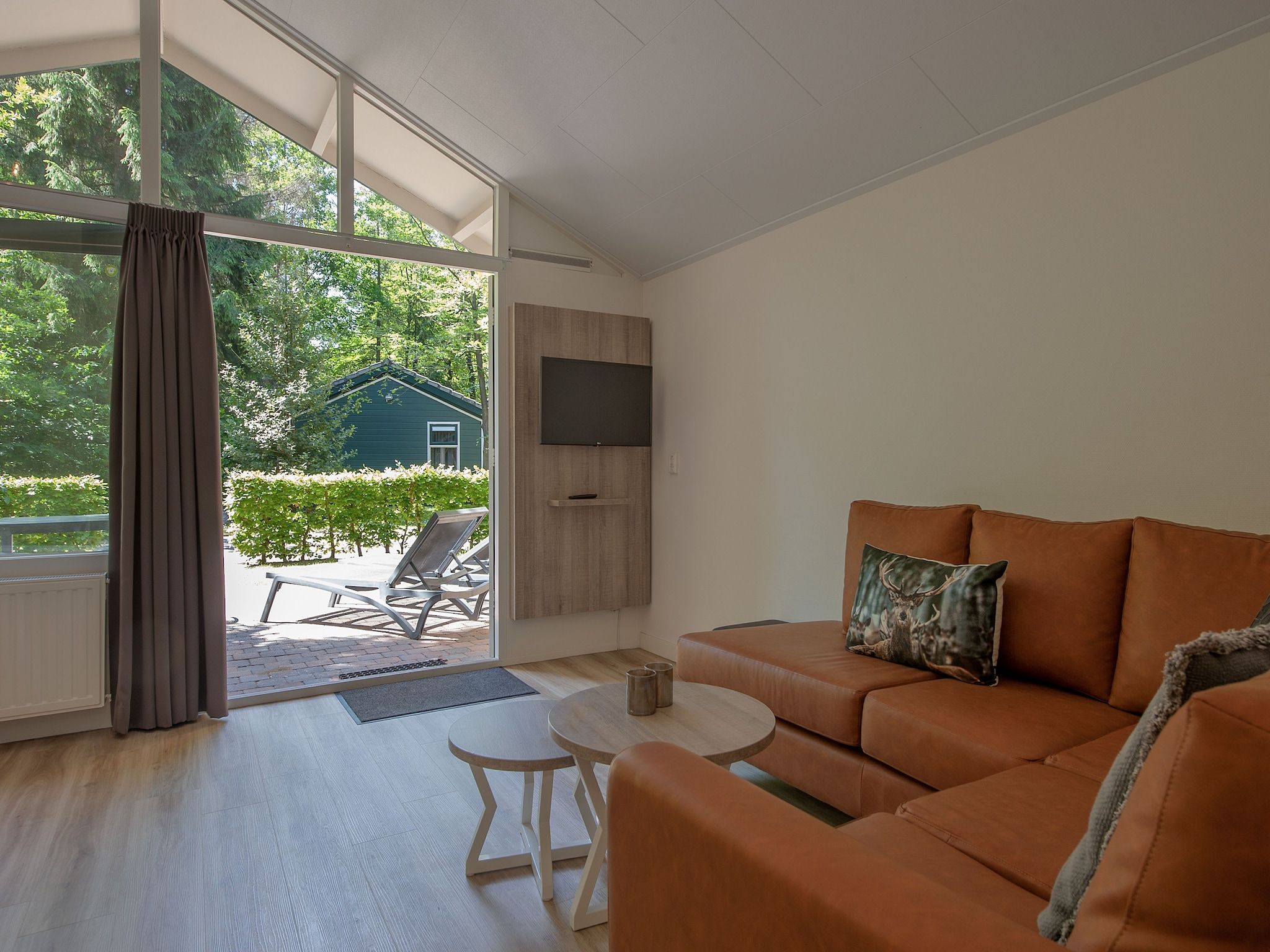 De woonkamer van Bospark de Schaapskooi 9 in Wissel/Epe