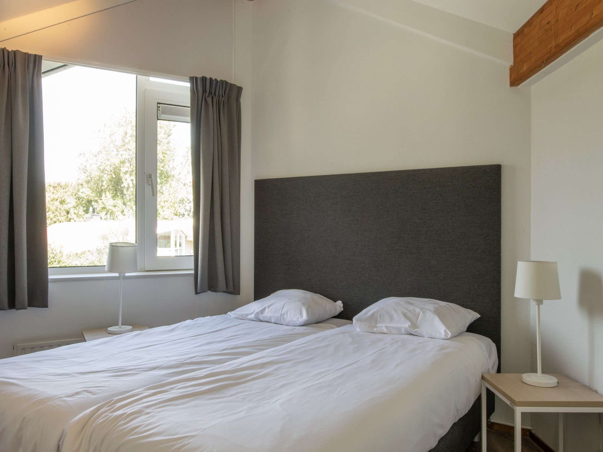 Een slaapkamer van Vakantiepark Hof Domburg 25 in Domburg