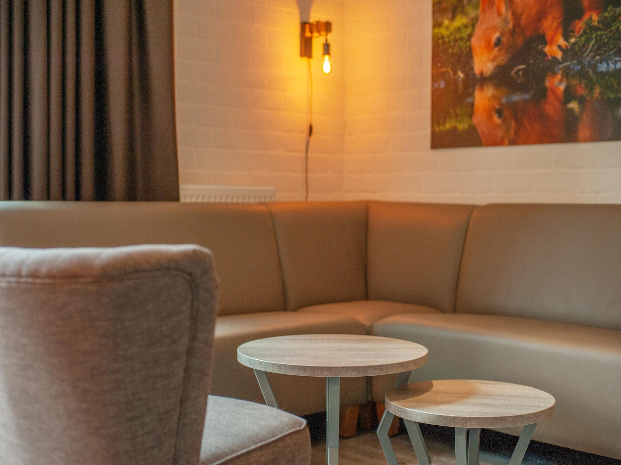 De woonkamer van Vakantiepark de Katjeskelder 15 in Oosterhout