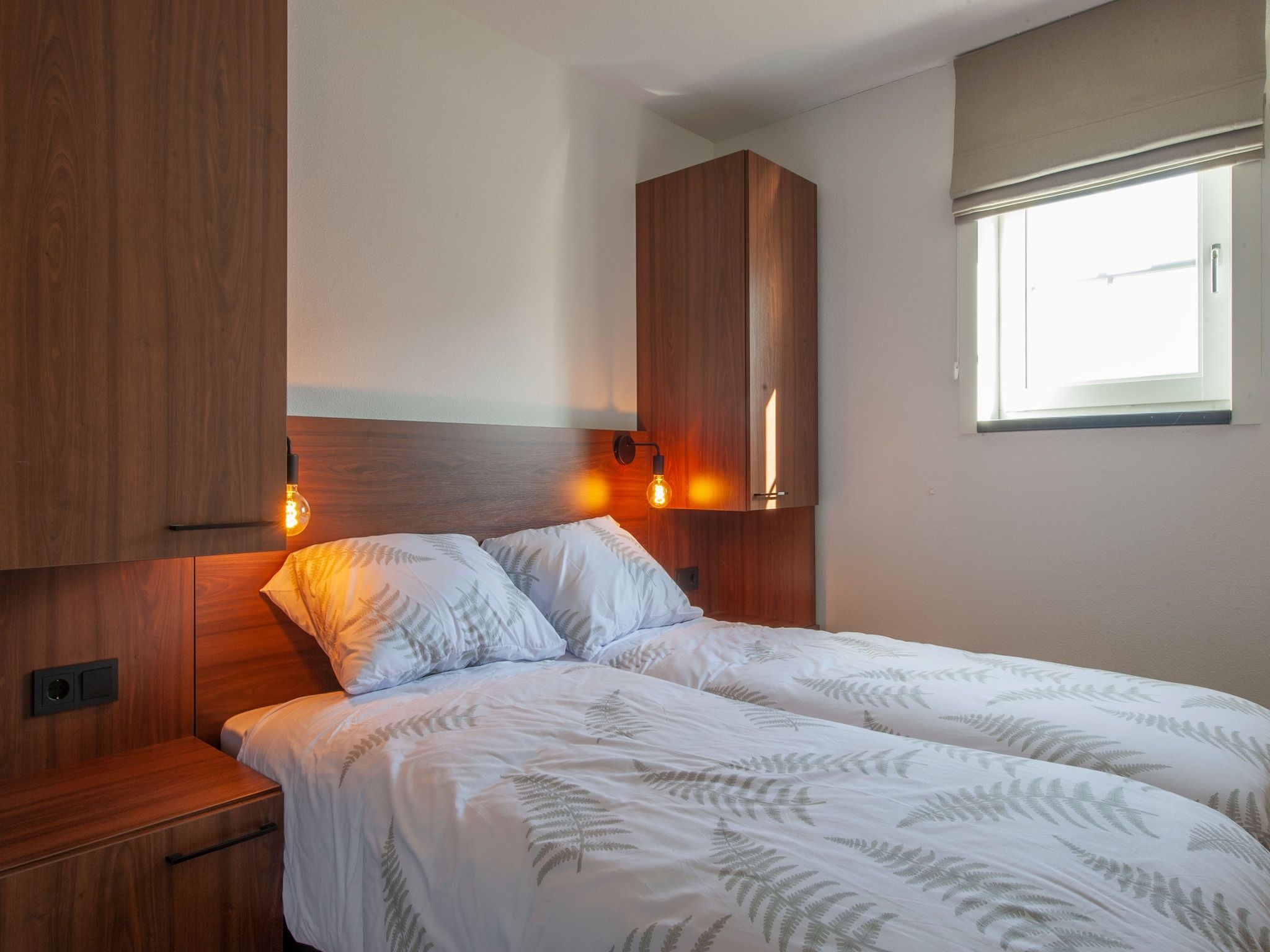 Een slaapkamer van Vakantiepark De Heihorsten 2 in Someren