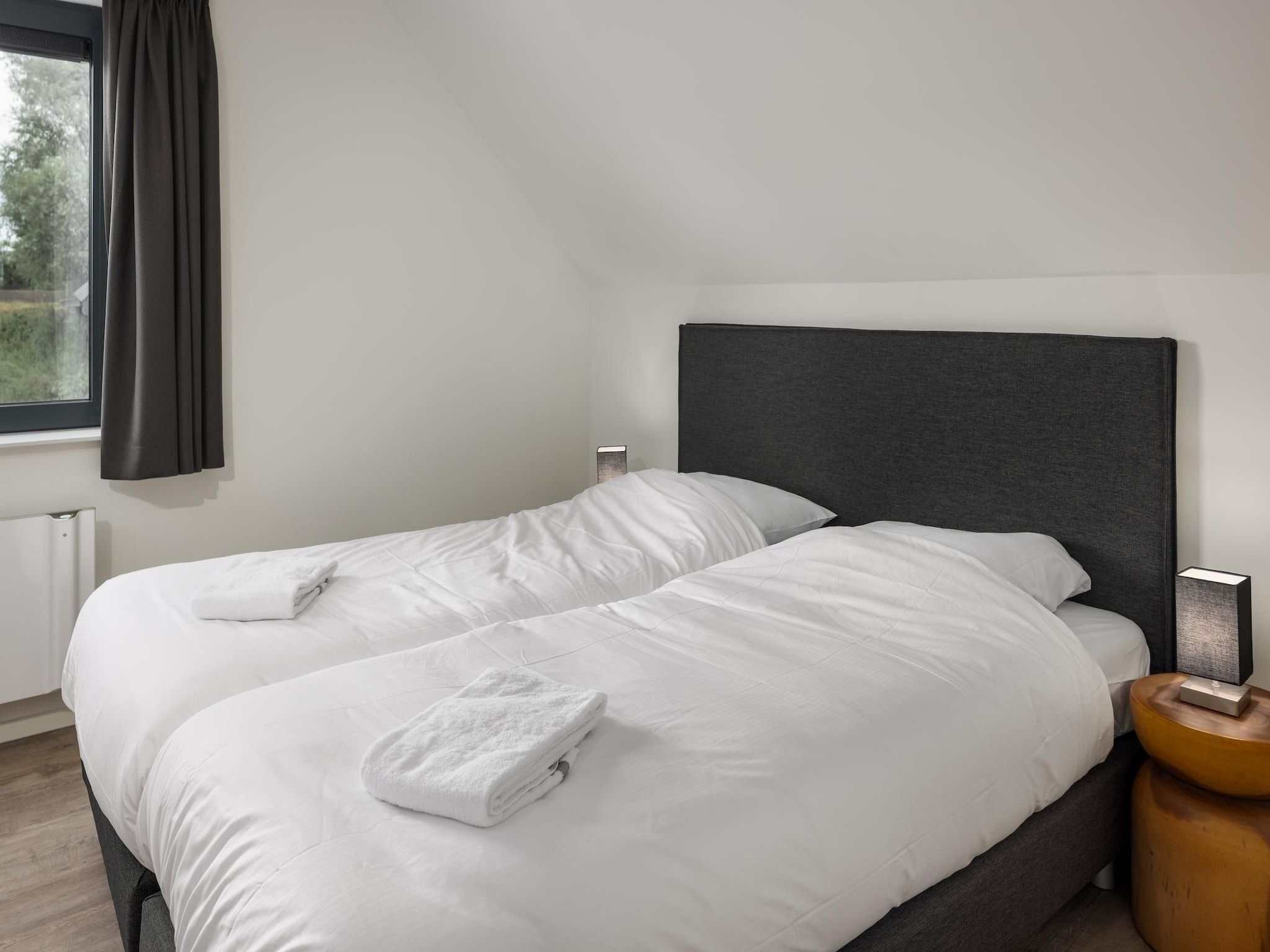 Een slaapkamer van Park Veerse Kreek 6 in Wolphaartsdijk