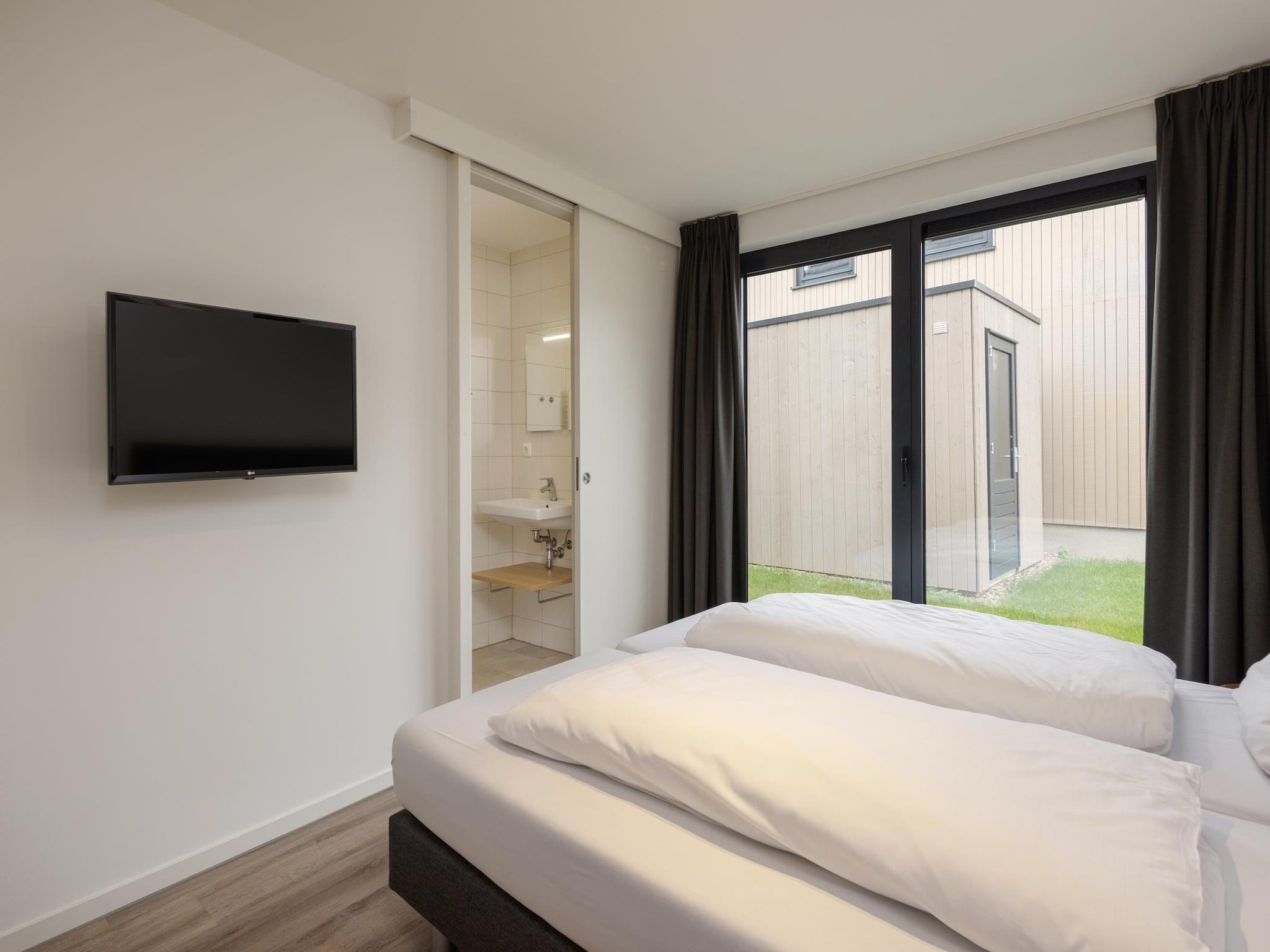 Een slaapkamer van Park Veerse Kreek 7 in Wolphaartsdijk