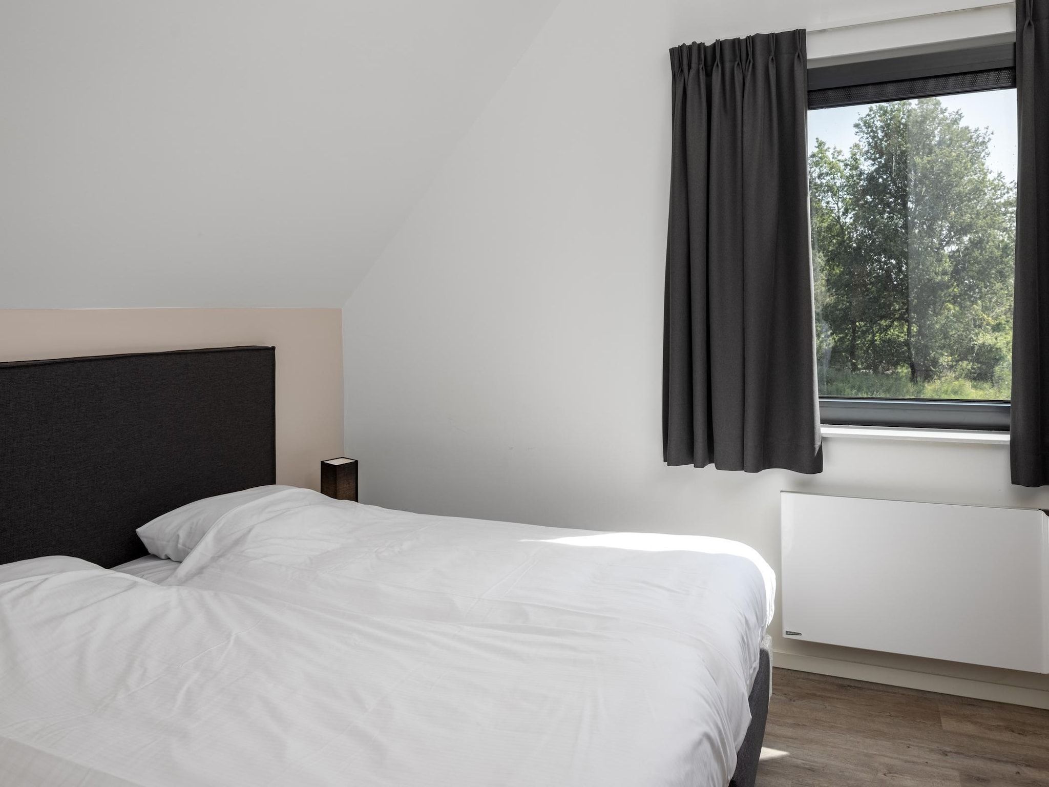 Een slaapkamer van Park Veerse Kreek 8 in Wolphaartsdijk