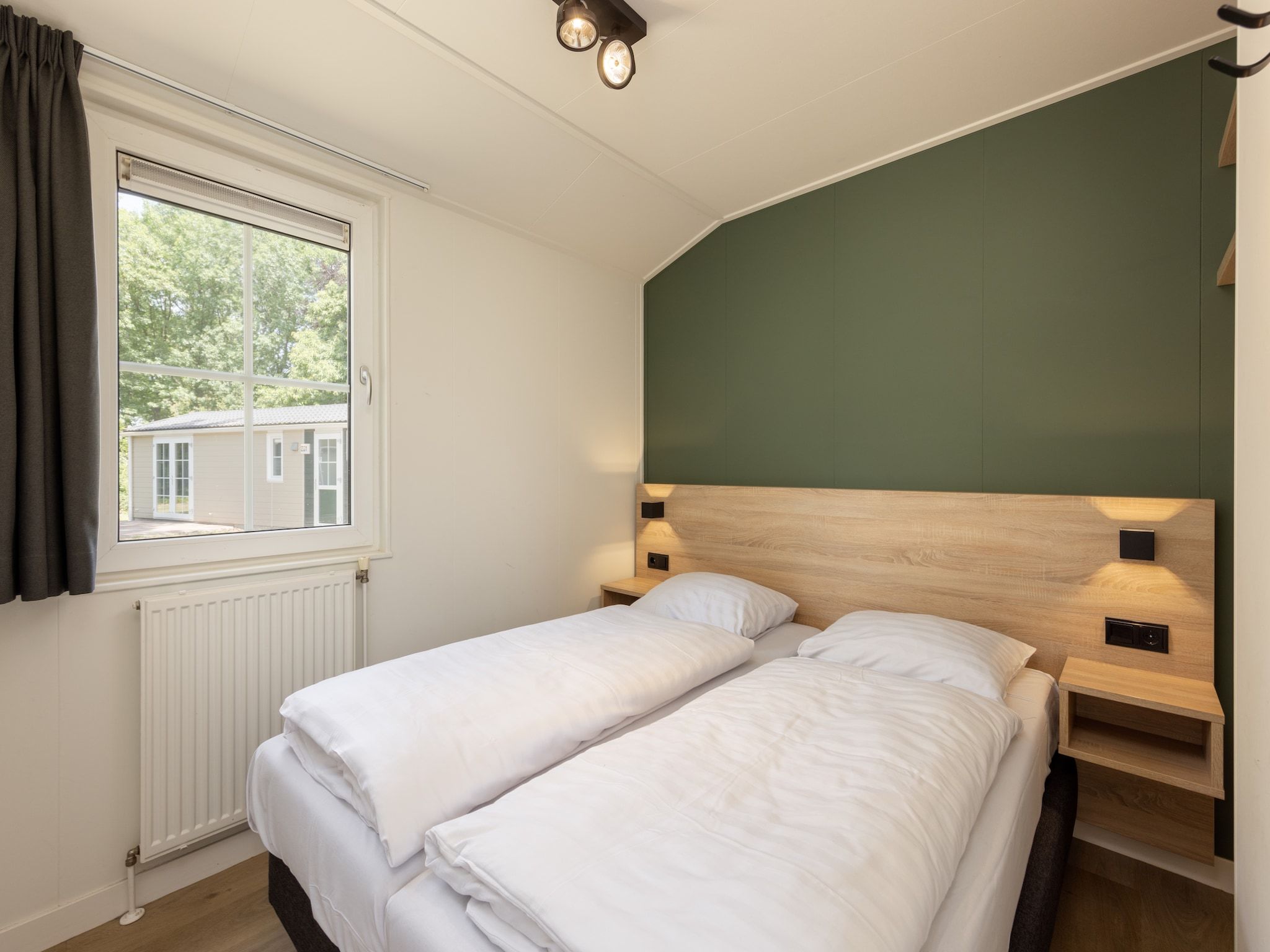 Een slaapkamer van Park De Peel 1 in Vlierden