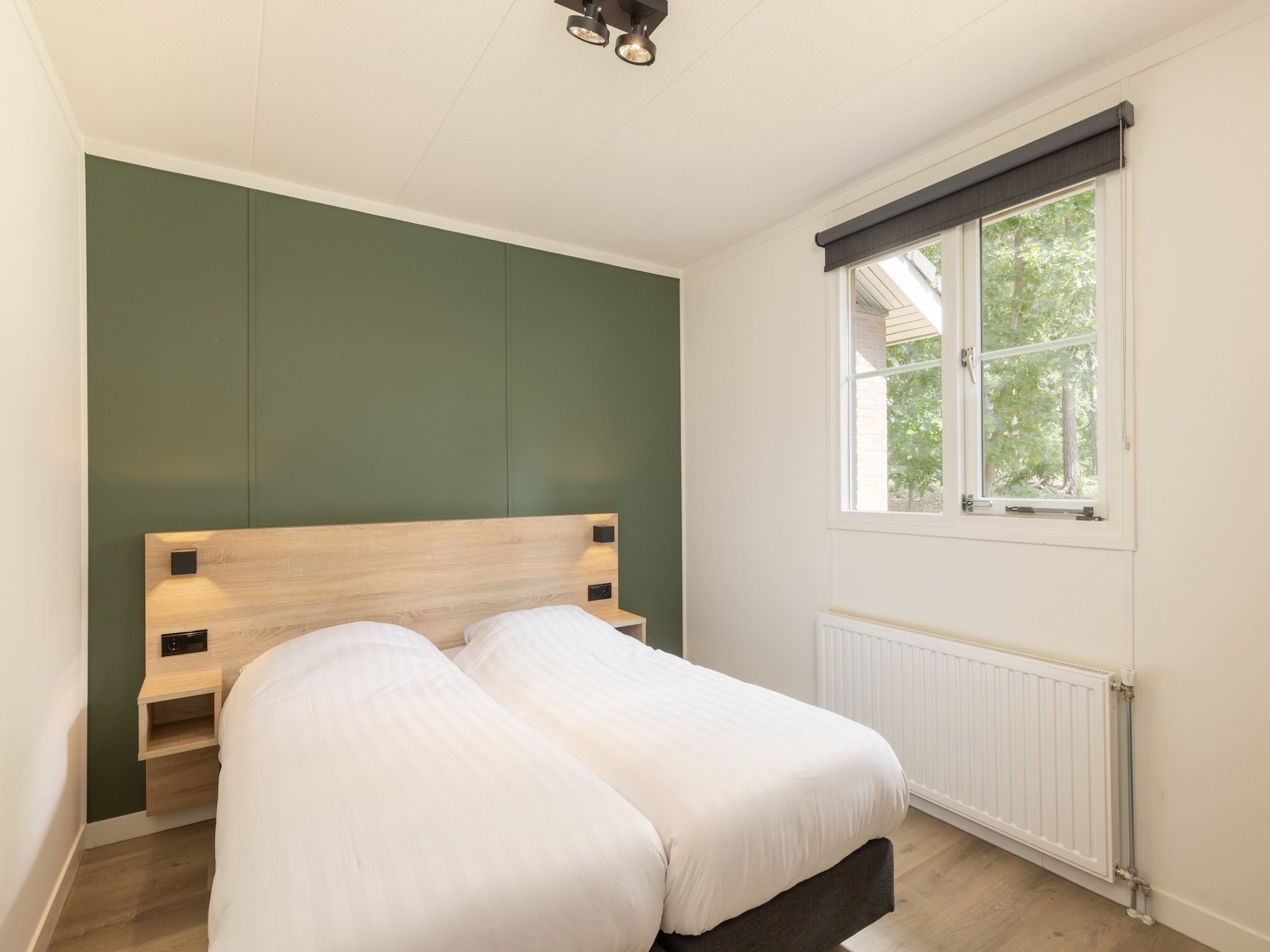 Een slaapkamer van Park De Peel 4 in Vlierden