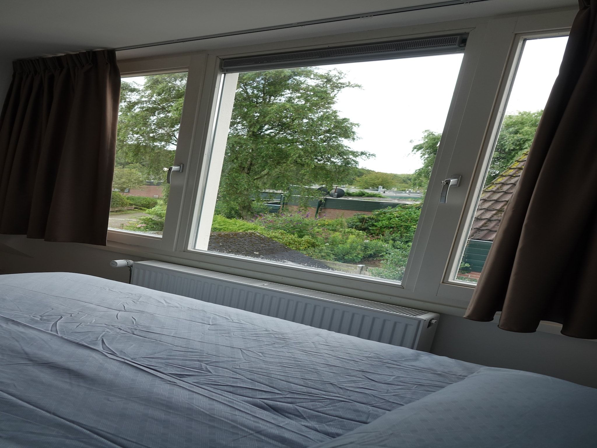 Een slaapkamer van Relaxing Summer in Noordwijkerhout