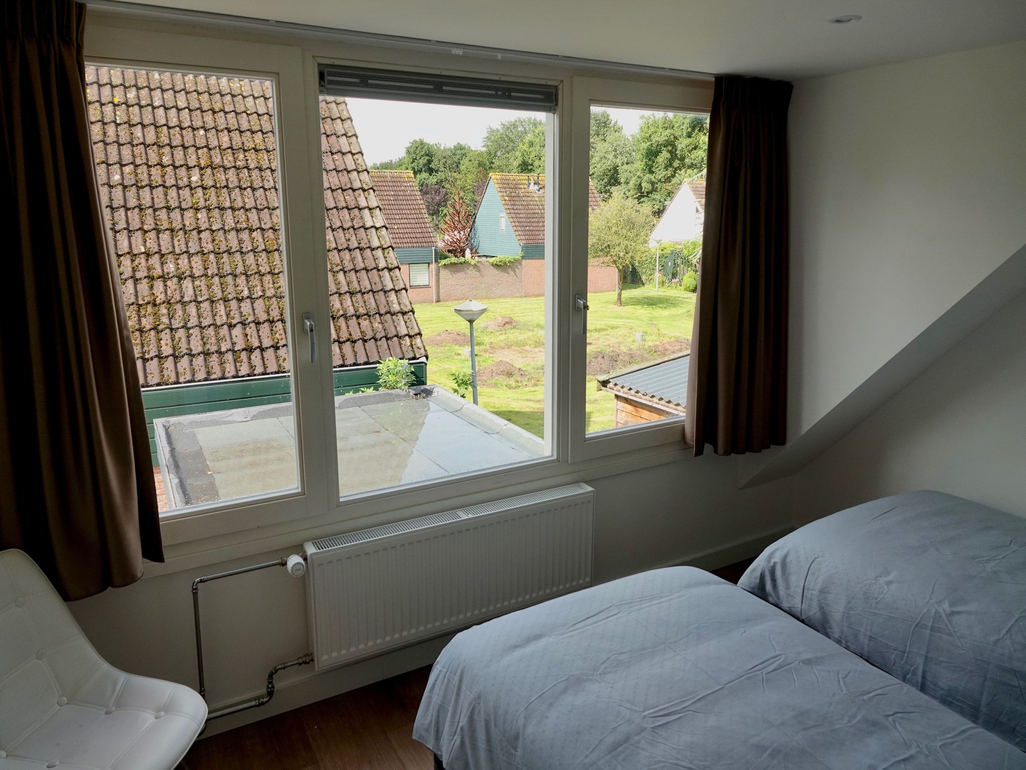 Een slaapkamer van Relaxing Summer in Noordwijkerhout