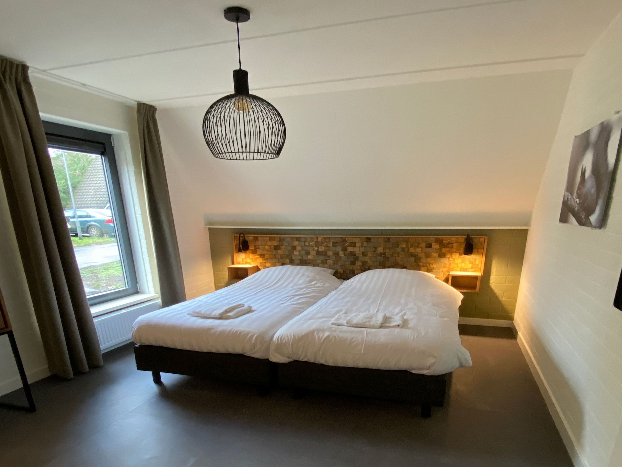 Een slaapkamer van Vakantiepark de Katjeskelder 20 in Oosterhout