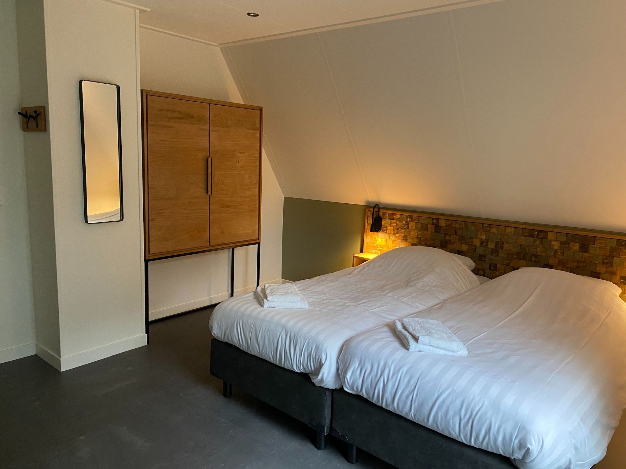 Een slaapkamer van Vakantiepark de Katjeskelder 20 in Oosterhout