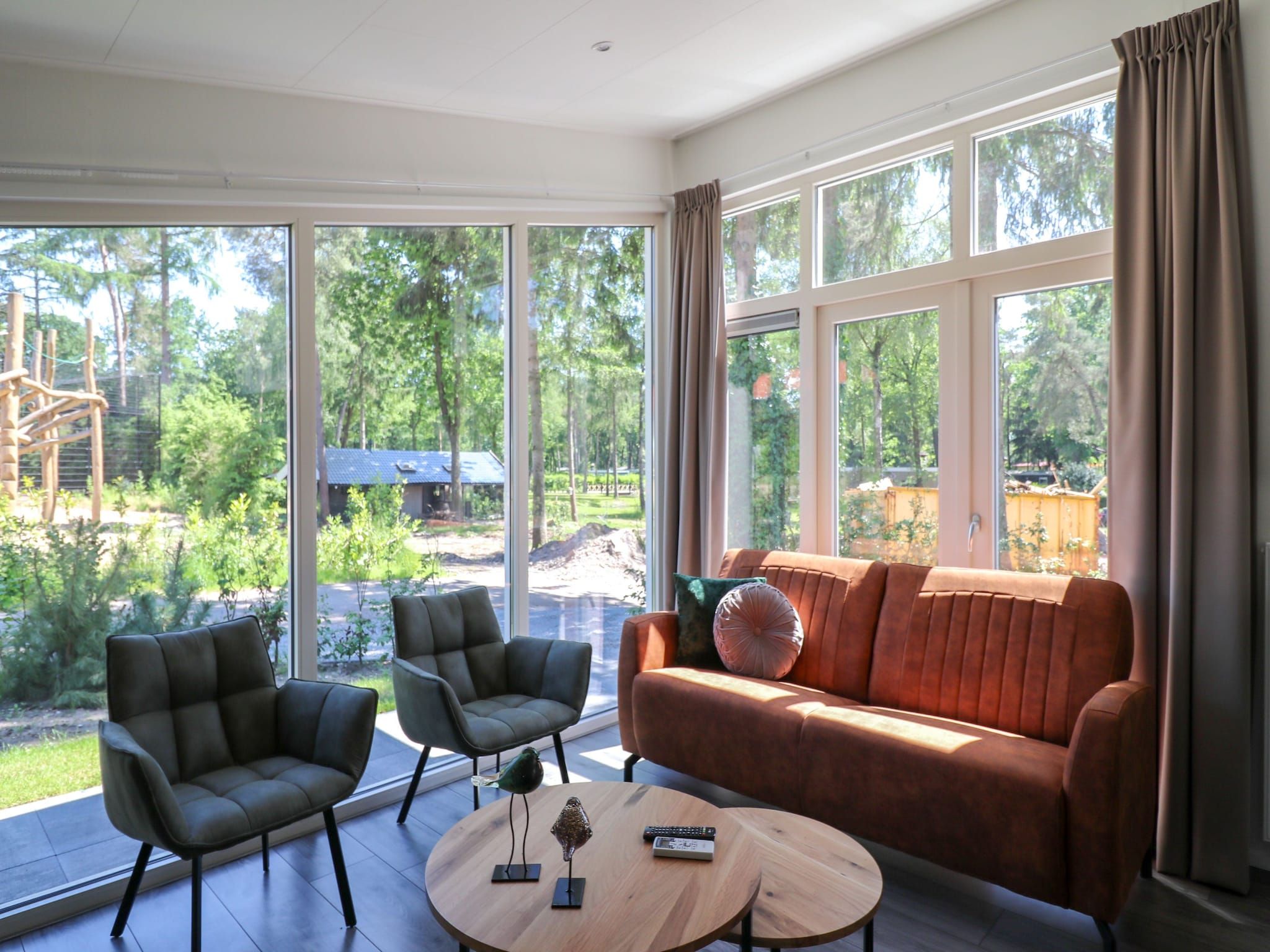 De woonkamer van Vakantiepark De Rimboe & De Woeste Hoogte 22 in Hoenderloo