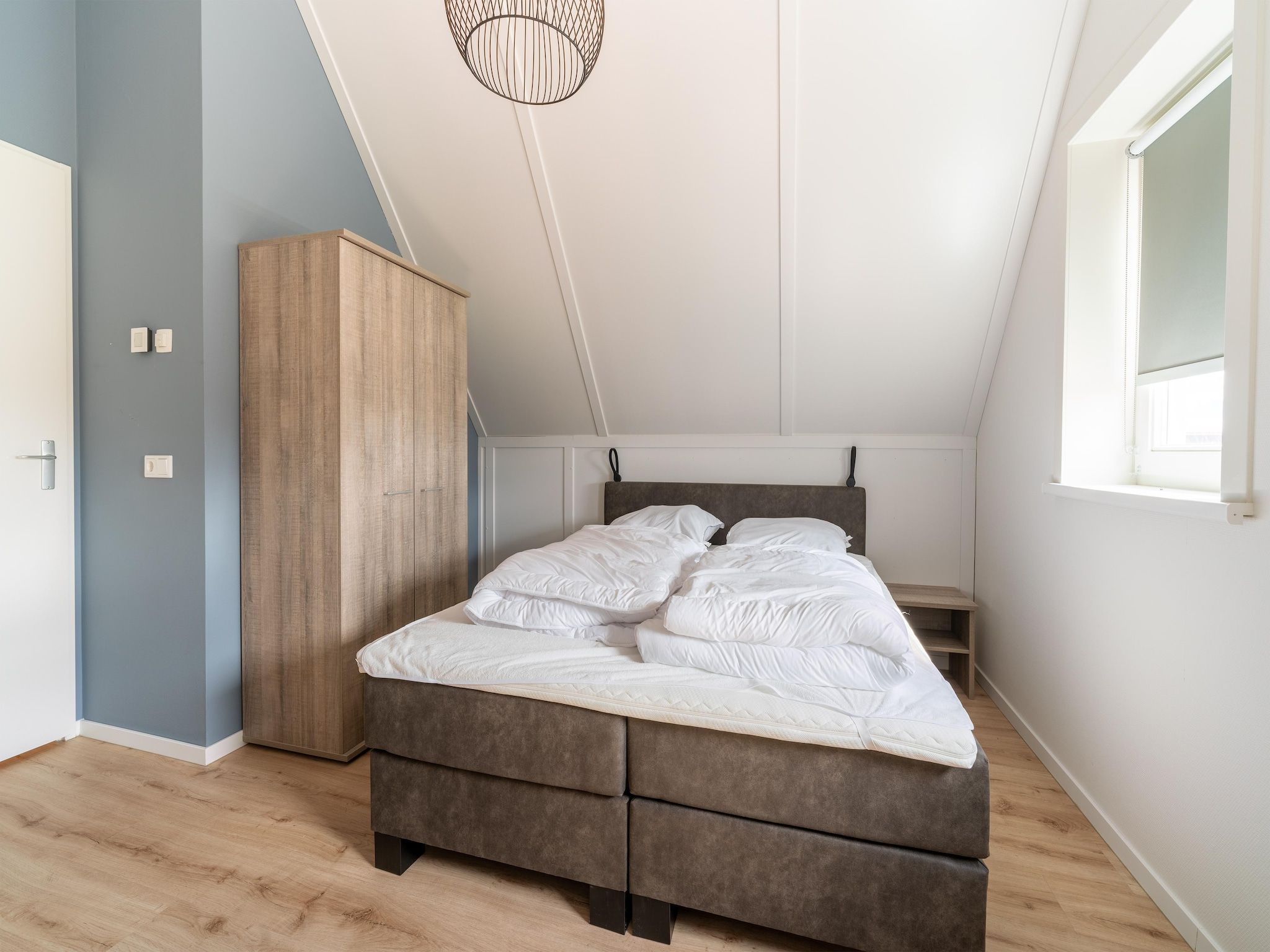 Een slaapkamer van De Kievit Huis Nr 36 in Scherpenisse