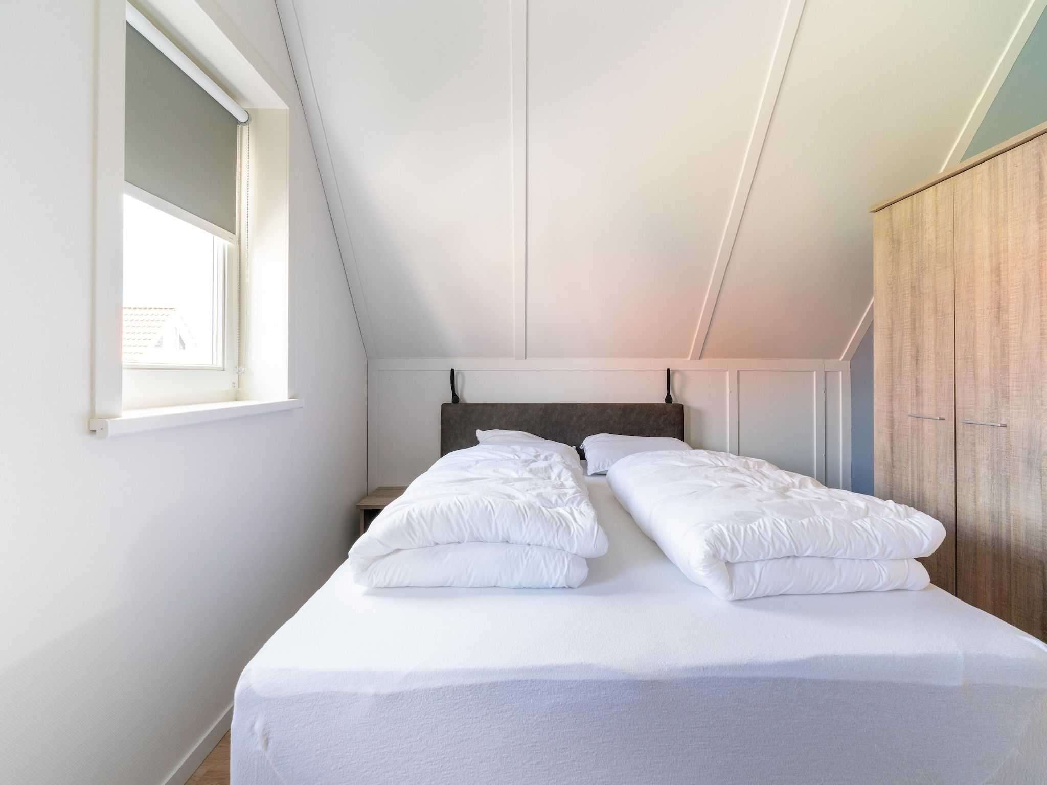 Een slaapkamer van De Kievit Huis Nr 36 in Scherpenisse