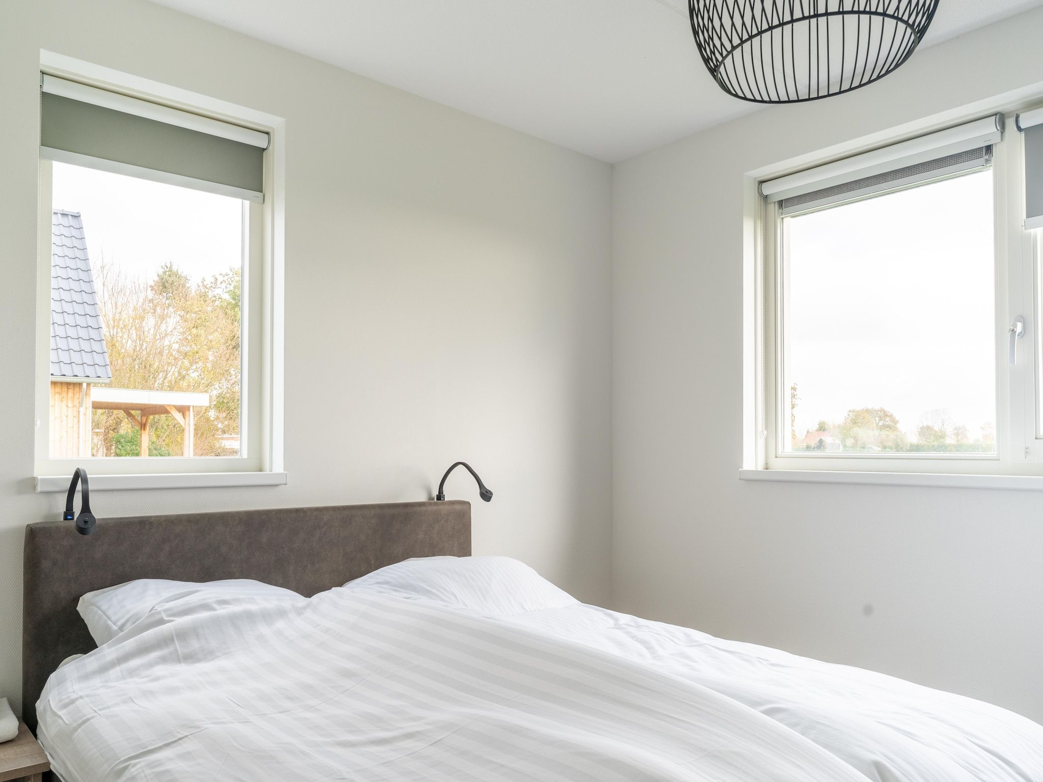 Een slaapkamer van De Kokmeeuw Huis Nr 11 in Scherpenisse