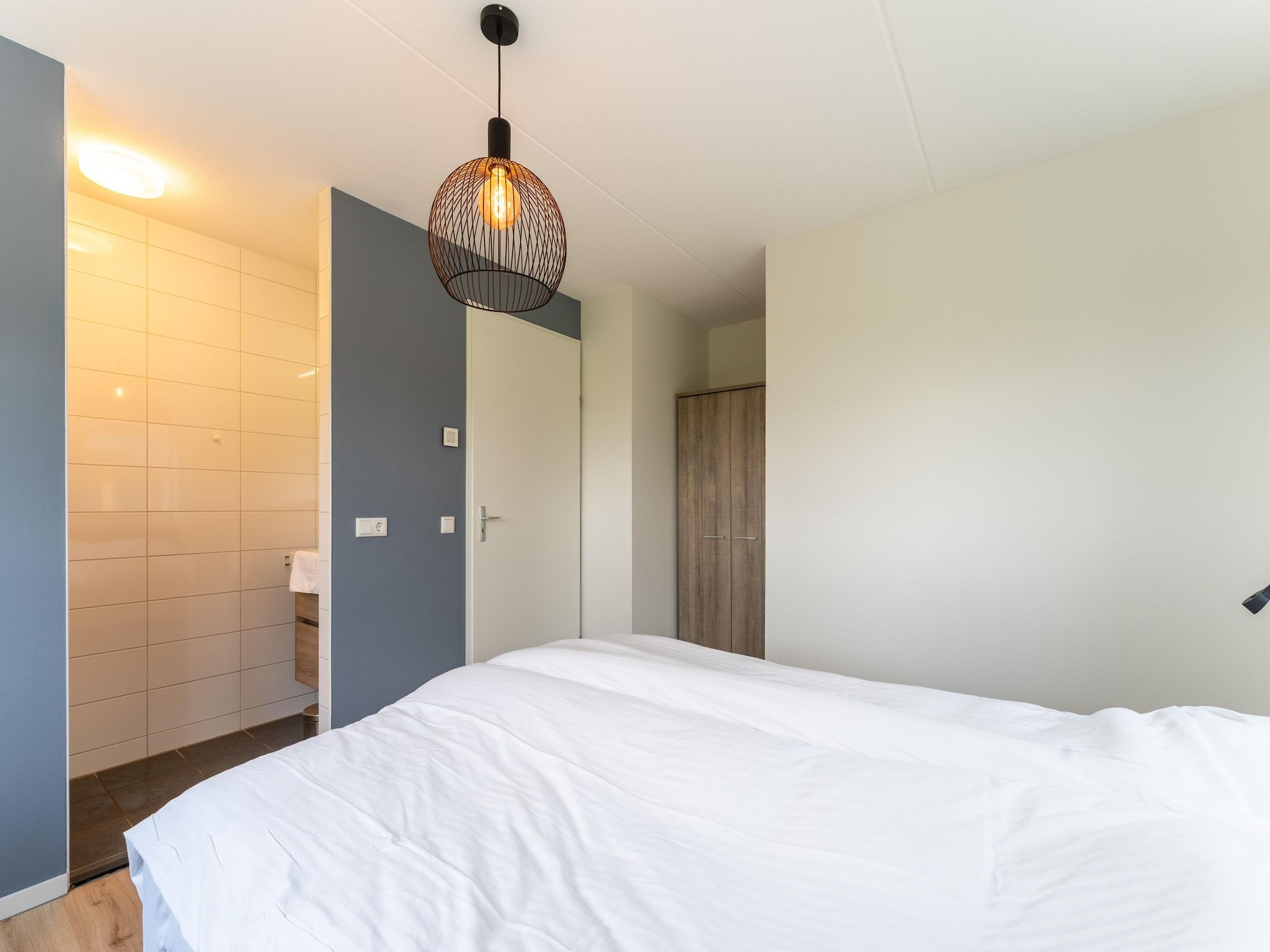 Een slaapkamer van De Kokmeeuw Huis Nr 11 in Scherpenisse