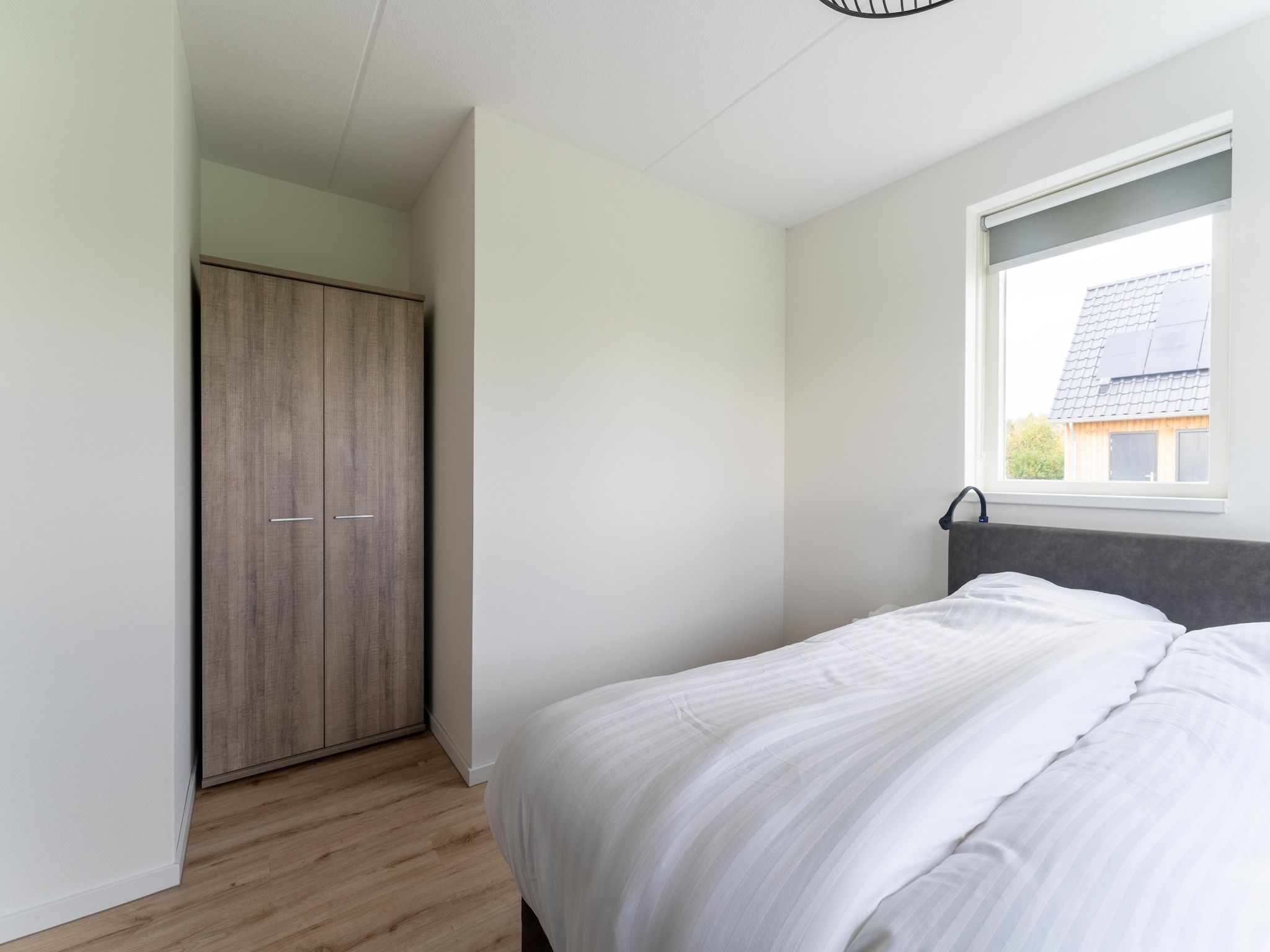 Een slaapkamer van De Kokmeeuw Huis Nr 11 in Scherpenisse