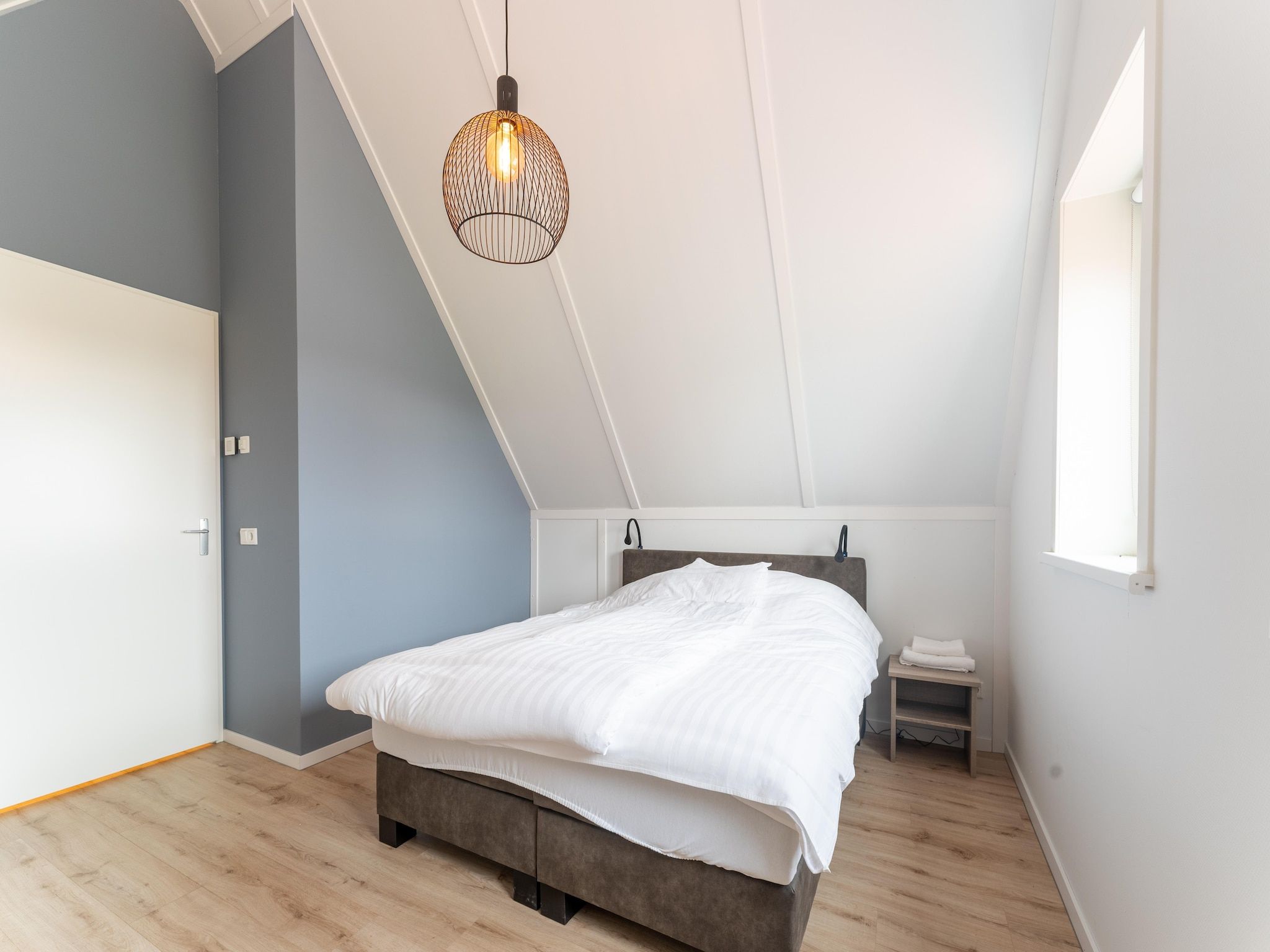 Een slaapkamer van De Kokmeeuw Huis Nr 11 in Scherpenisse