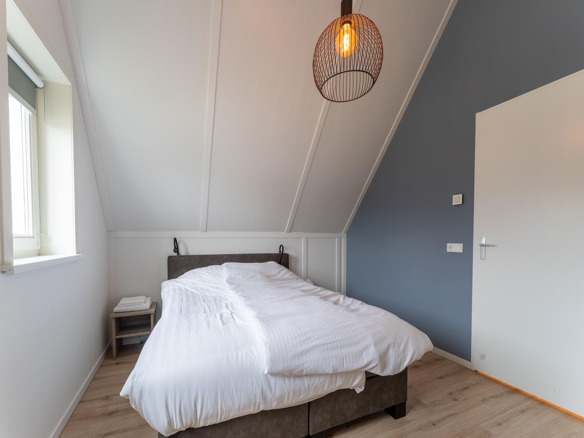 Een slaapkamer van De Kokmeeuw Huis Nr 11 in Scherpenisse