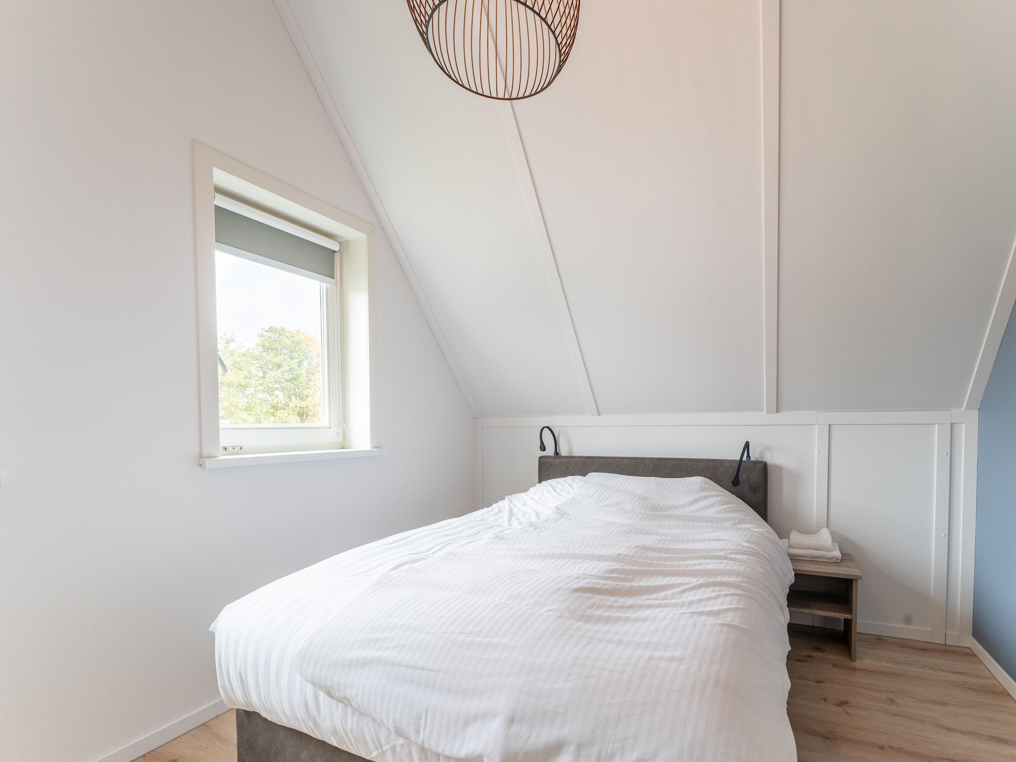 Een slaapkamer van De Kokmeeuw Huis Nr 11 in Scherpenisse