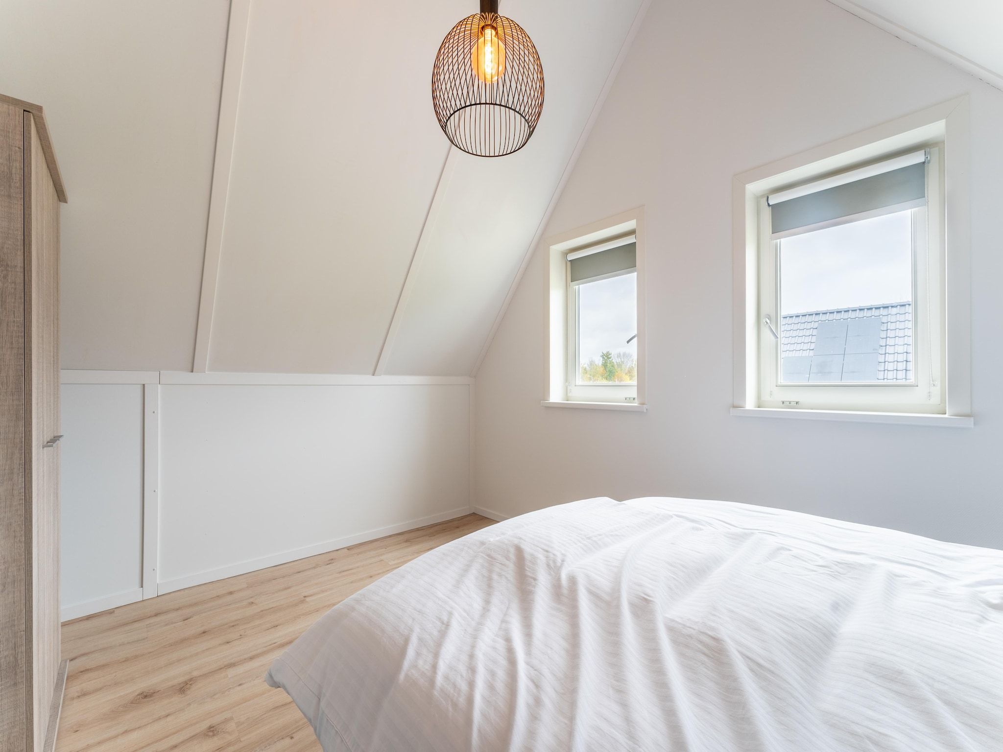 Een slaapkamer van De Kokmeeuw Huis Nr 11 in Scherpenisse