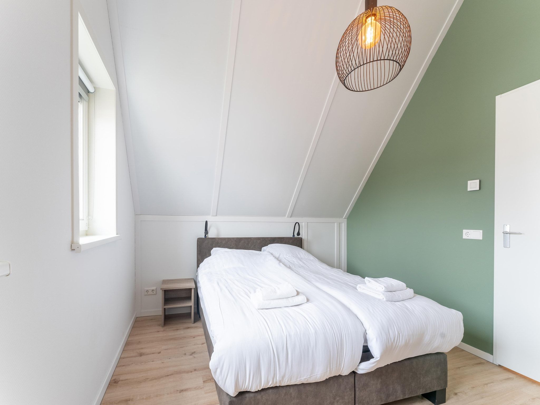 Een slaapkamer van De Lepelaar Huis Nr 13 in Scherpenisse