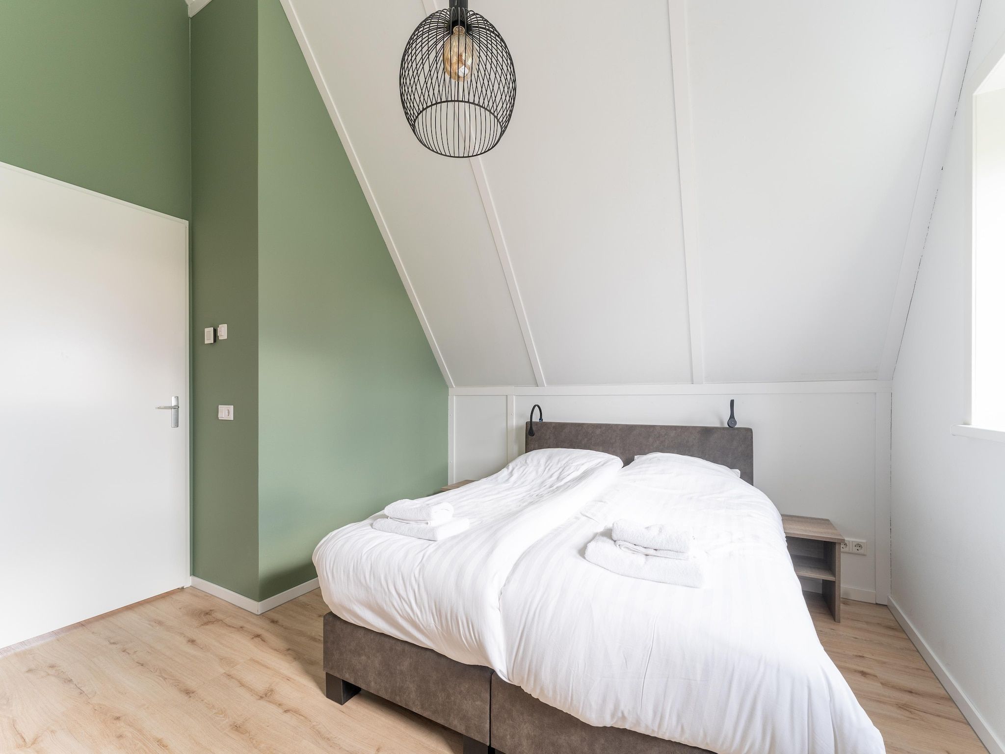 Een slaapkamer van De Lepelaar Huis Nr 13 in Scherpenisse