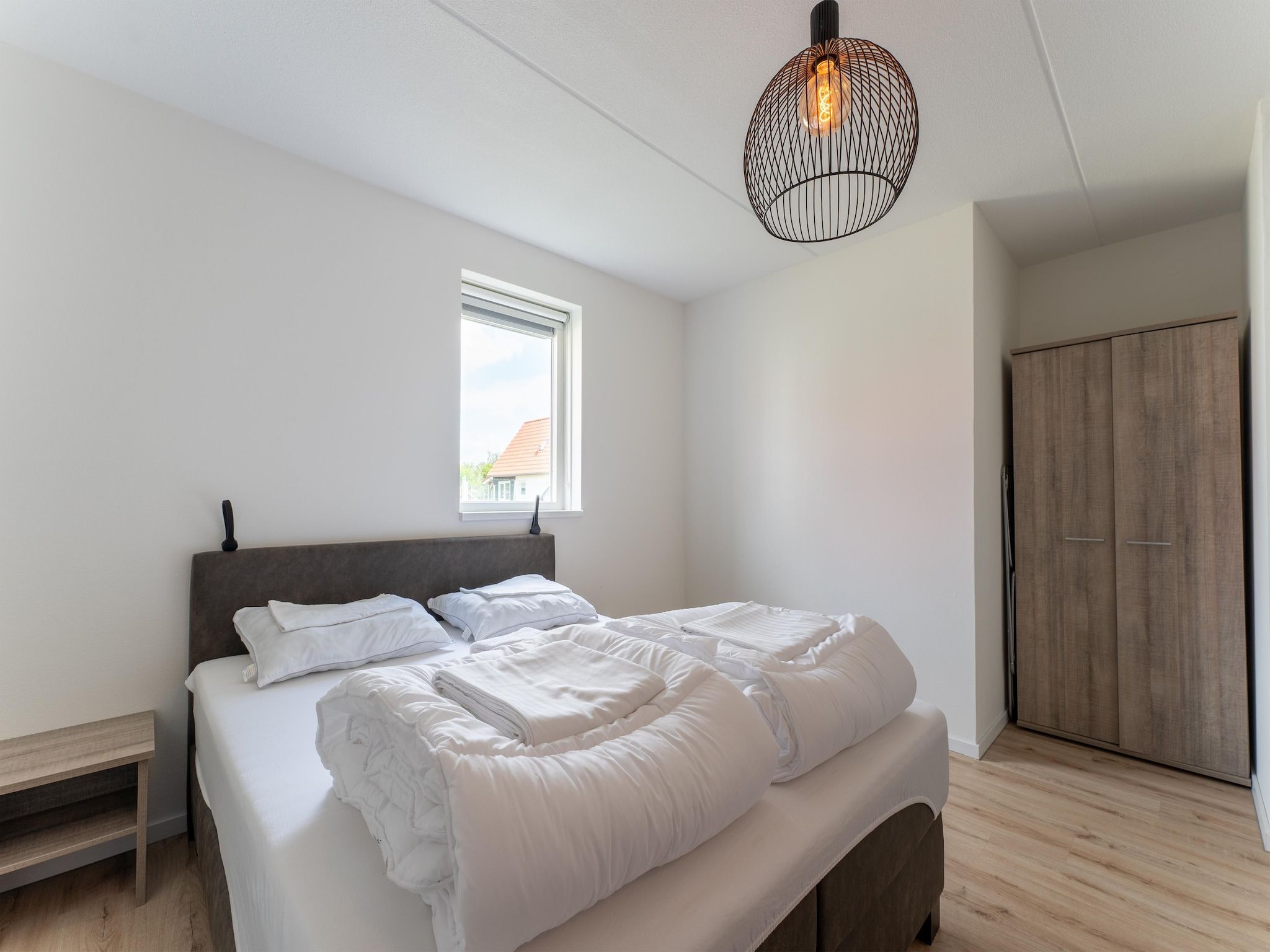 Een slaapkamer van De Scholekster Huis Nr 14 in Scherpenisse