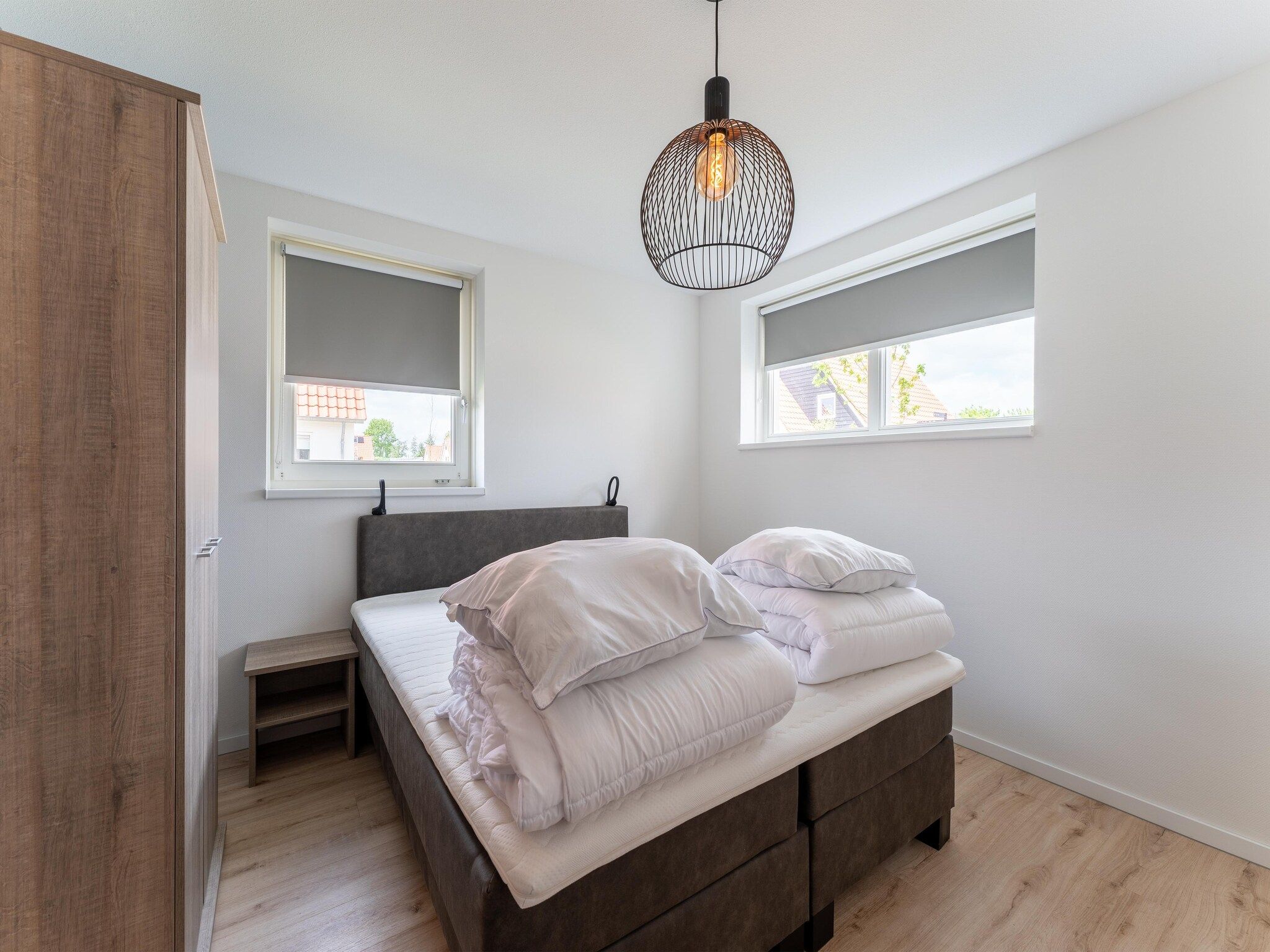 Een slaapkamer van De Scholekster Huis Nr 14 in Scherpenisse