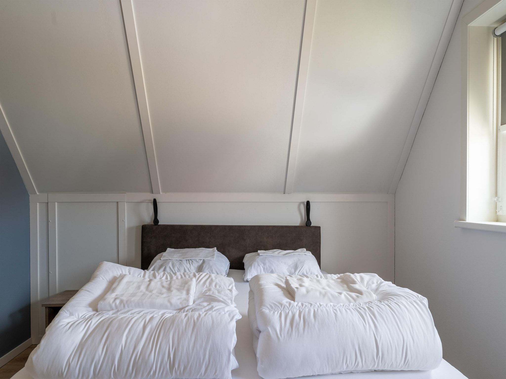 Een slaapkamer van De Scholekster Huis Nr 14 in Scherpenisse