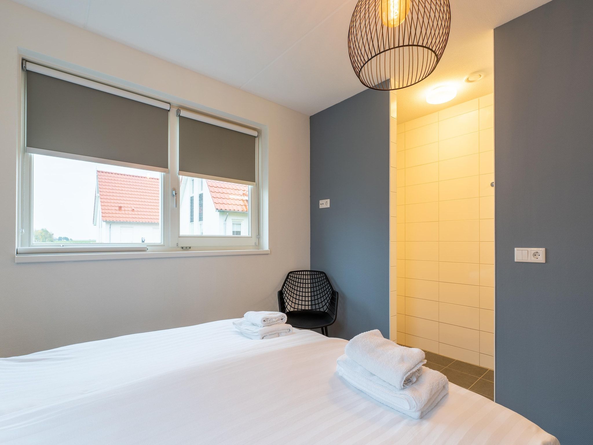 Een slaapkamer van De Wulp Huis Nr 50 in Scherpenisse