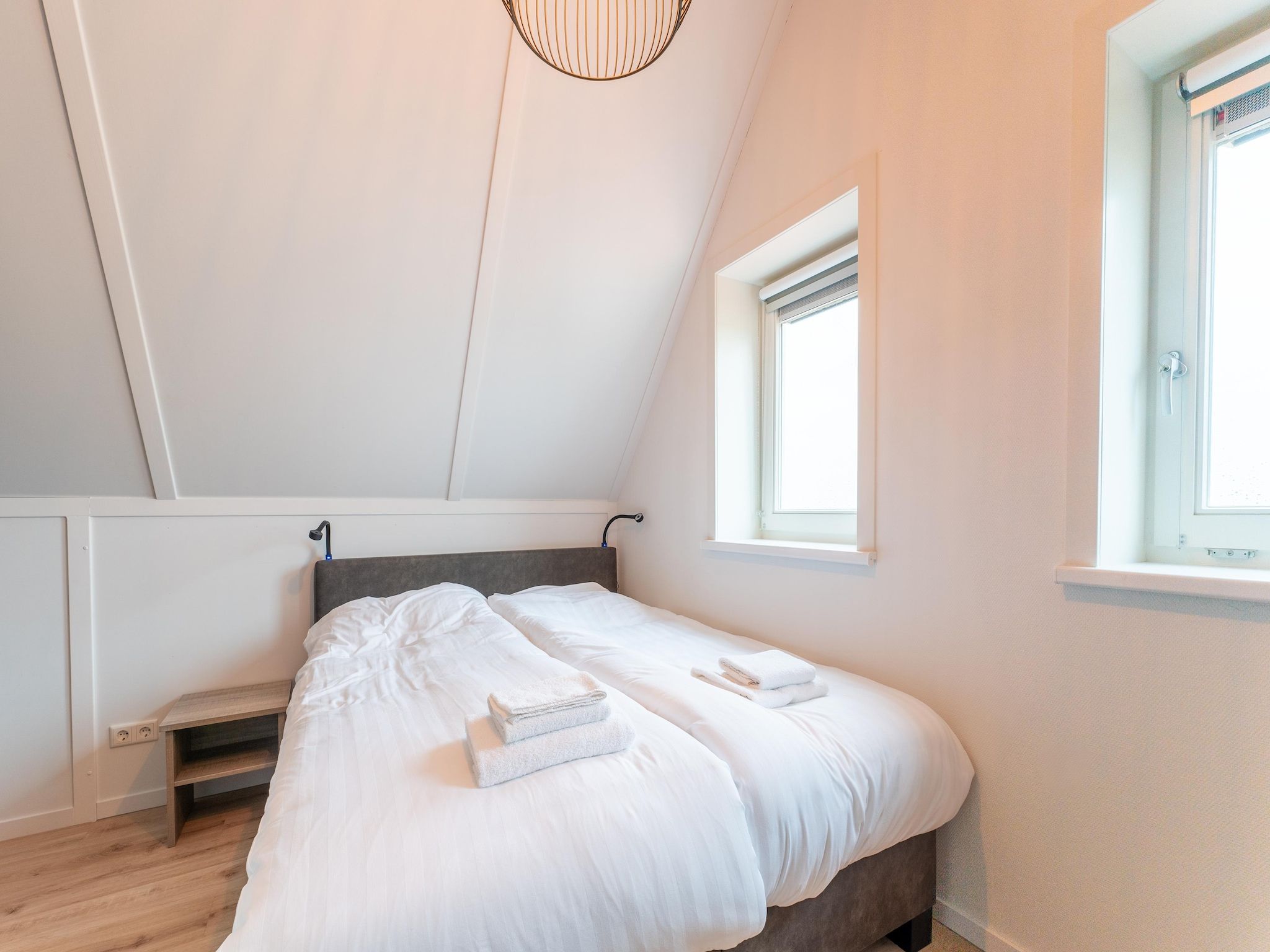 Een slaapkamer van De Wulp Huis Nr 50 in Scherpenisse