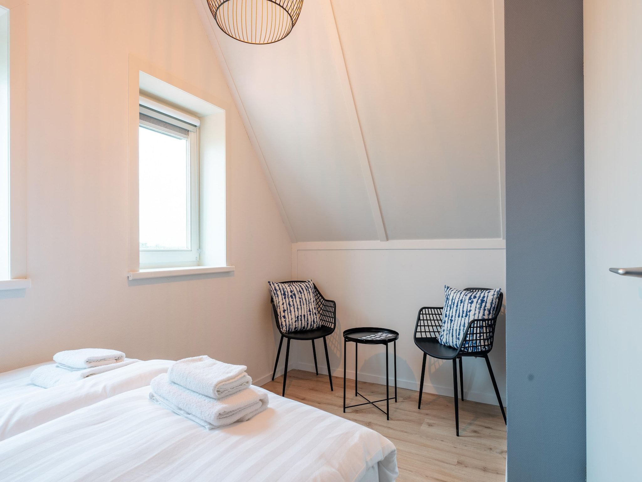 Een slaapkamer van De Wulp Huis Nr 50 in Scherpenisse