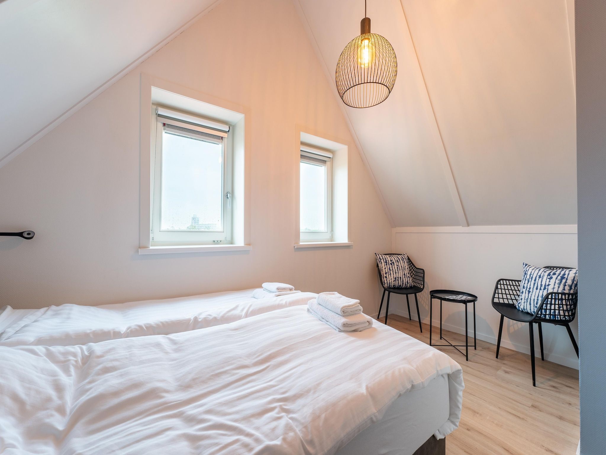 Een slaapkamer van De Wulp Huis Nr 50 in Scherpenisse