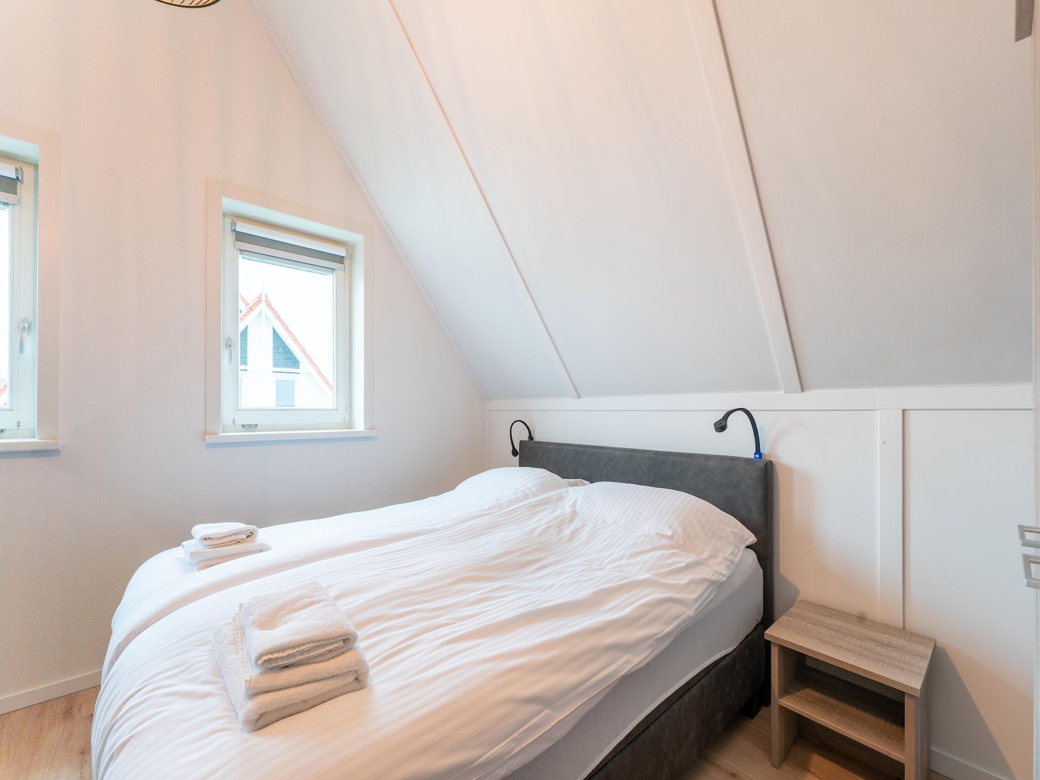 Een slaapkamer van De Wulp Huis Nr 50 in Scherpenisse