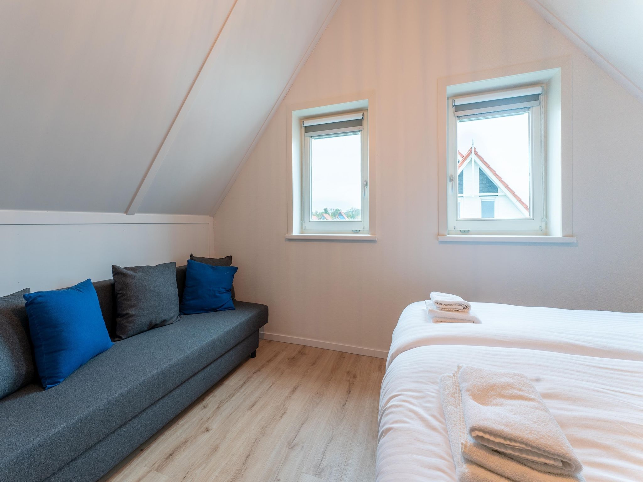 Een slaapkamer van De Wulp Huis Nr 50 in Scherpenisse