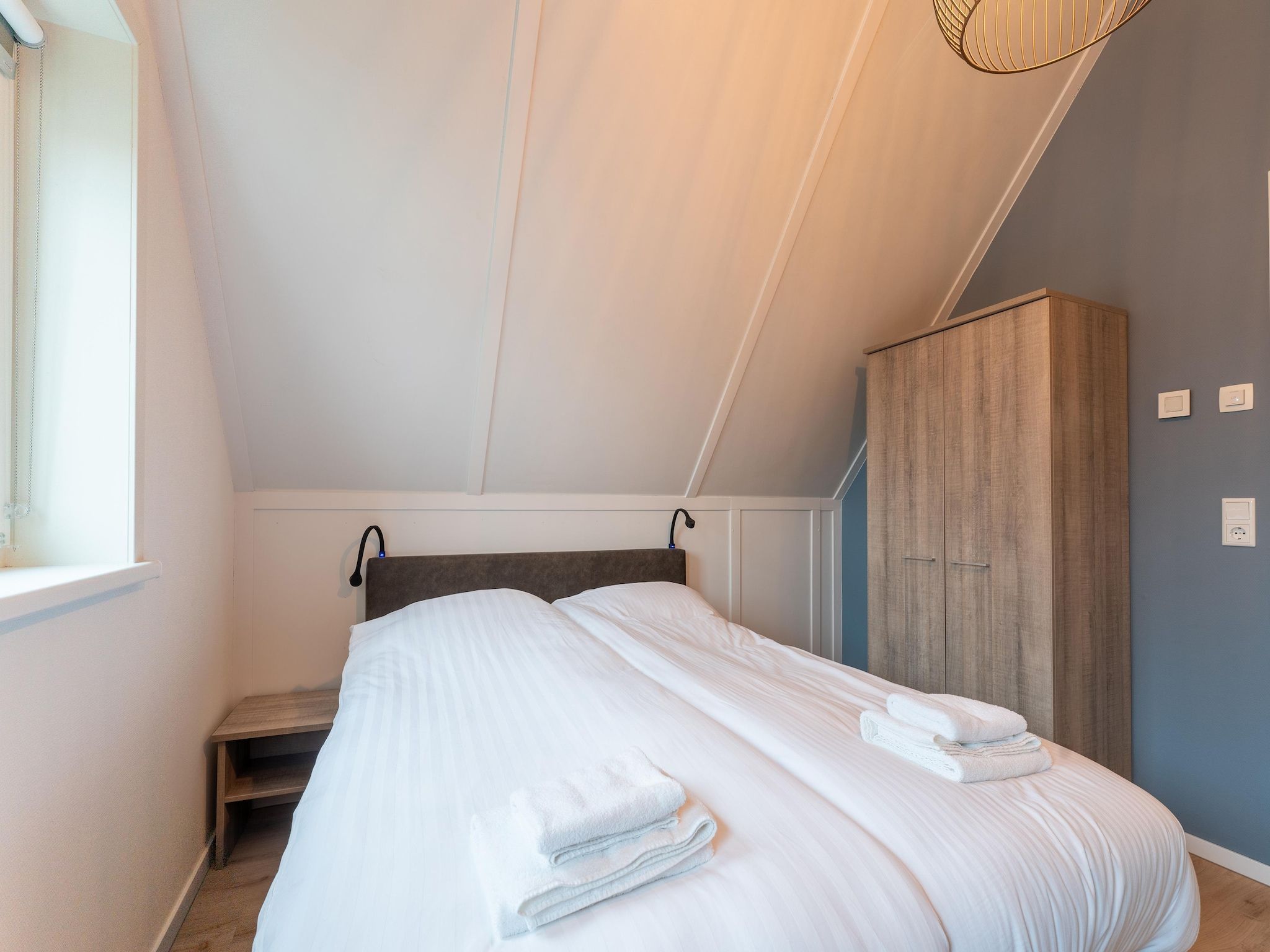 Een slaapkamer van De Wulp Huis Nr 50 in Scherpenisse