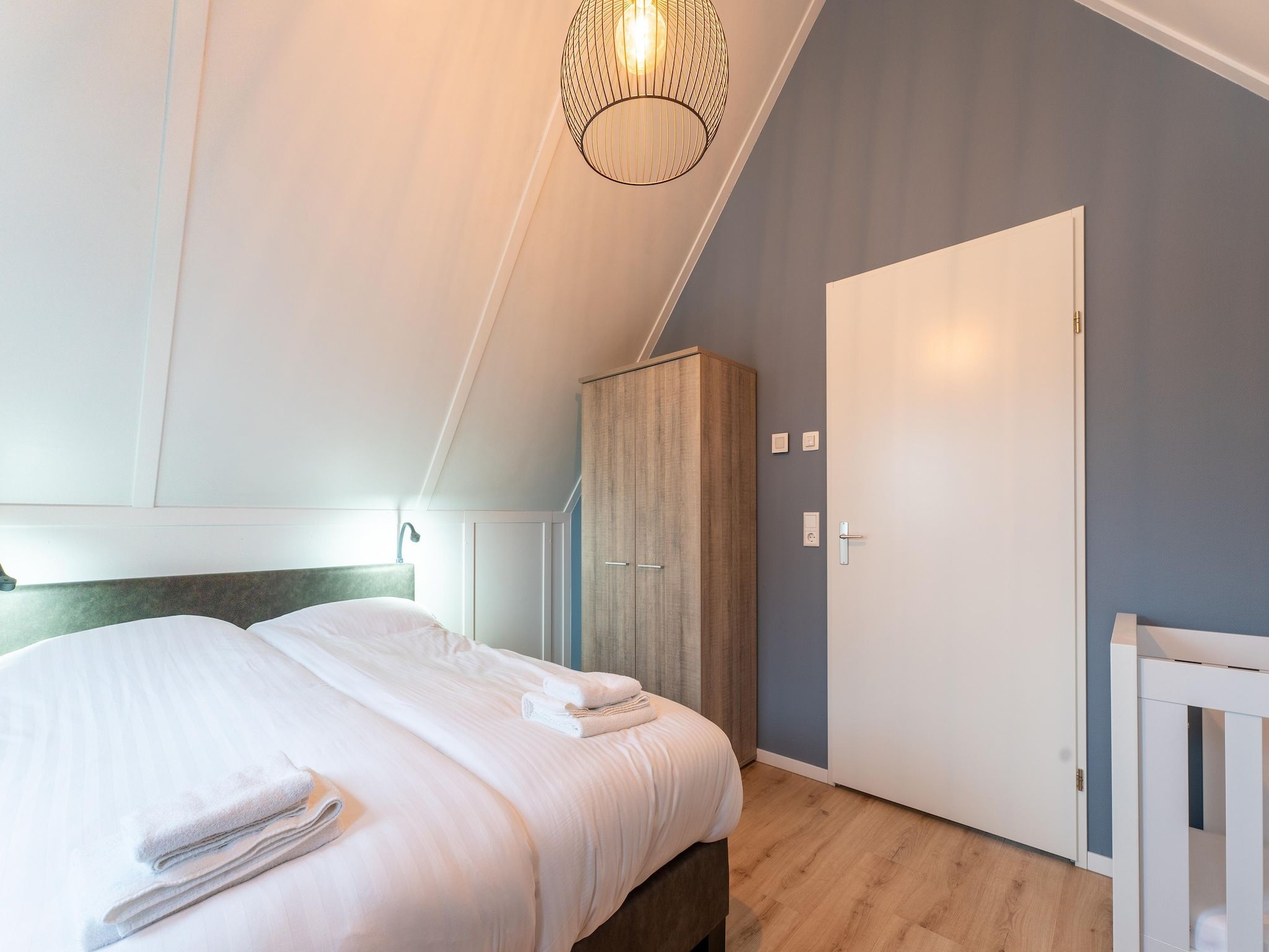 Een slaapkamer van De Wulp Huis Nr 50 in Scherpenisse