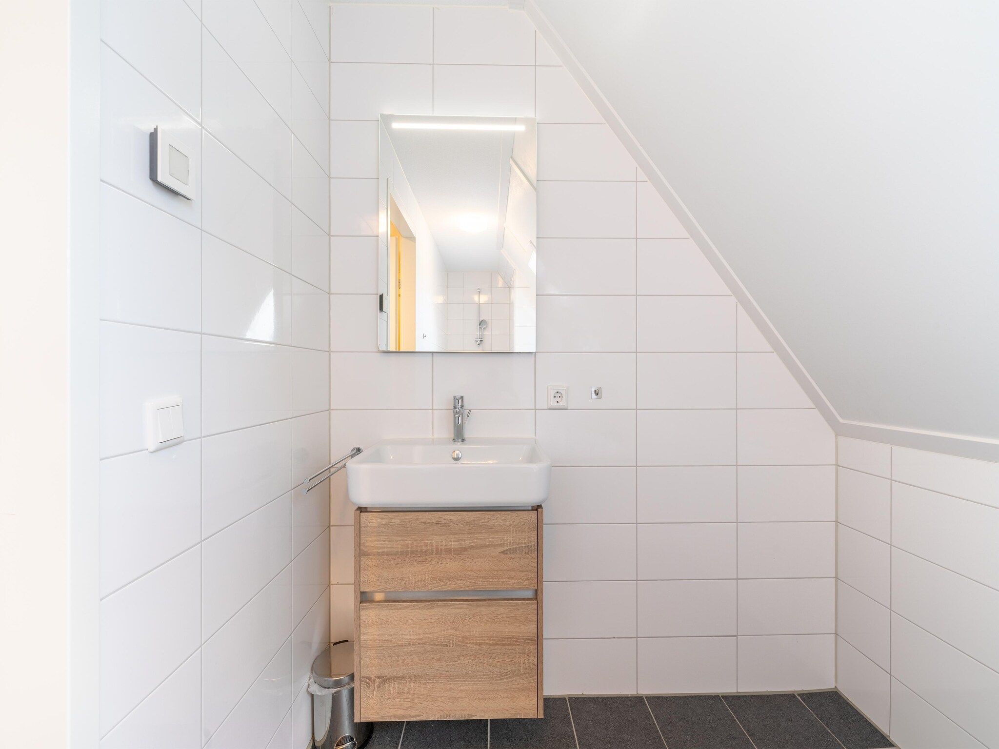 De badkamer van De Kluut Huis Nr 12 in Scherpenisse