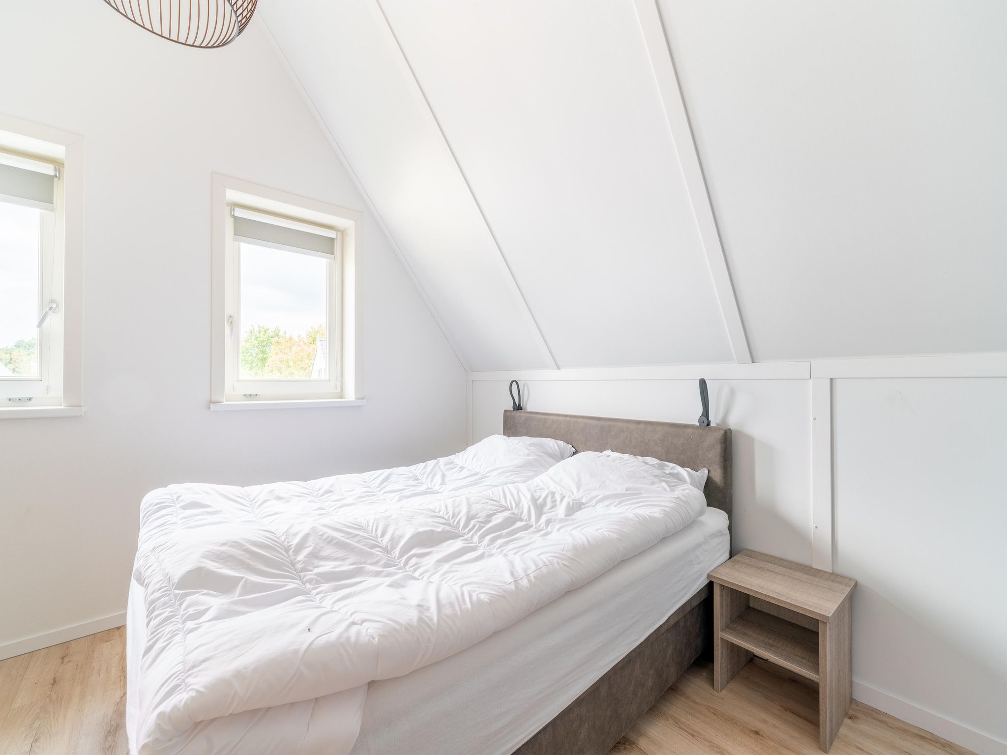 Een slaapkamer van De Kluut Huis Nr 12 in Scherpenisse