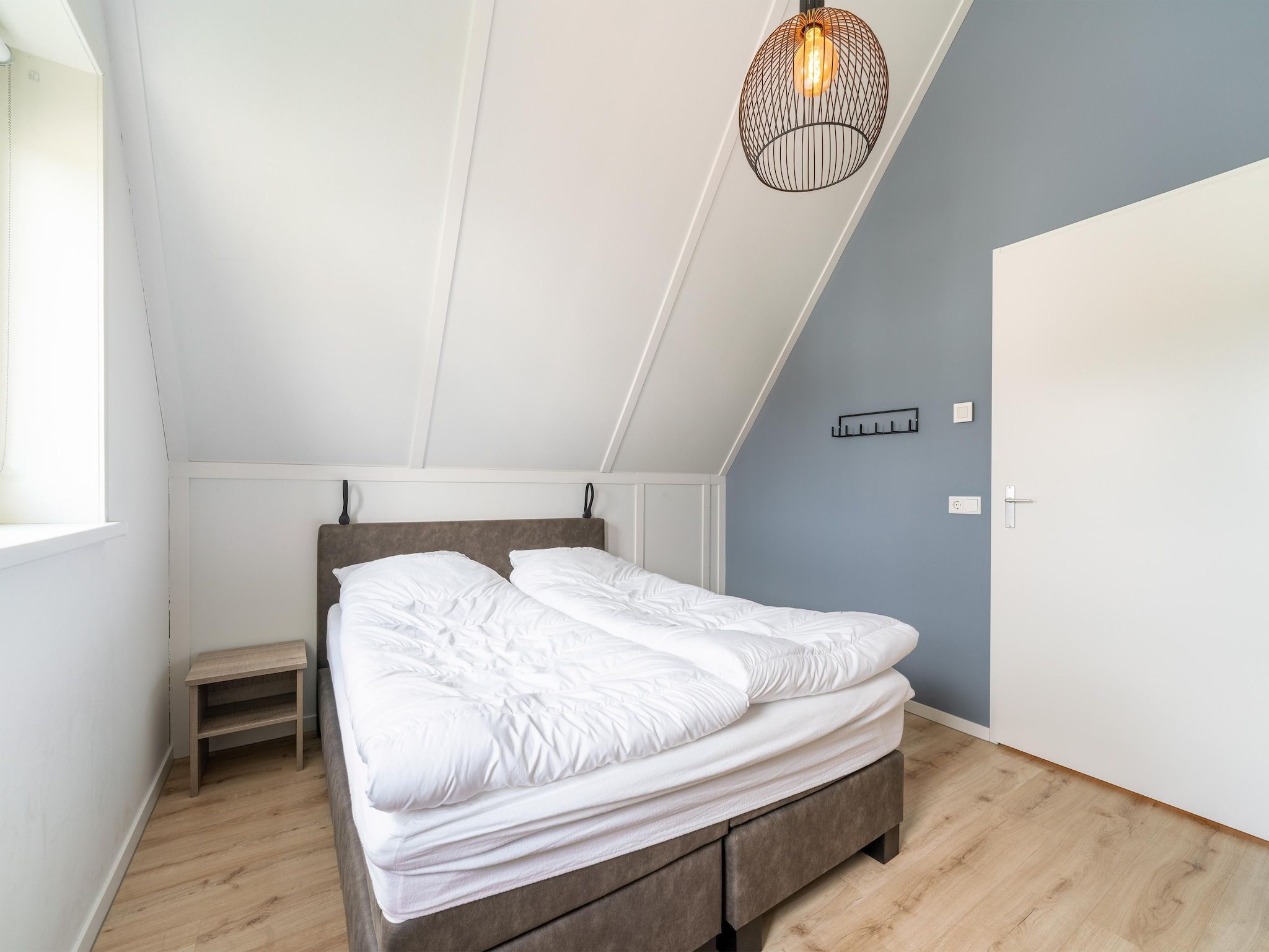 Een slaapkamer van De Kluut Huis Nr 12 in Scherpenisse