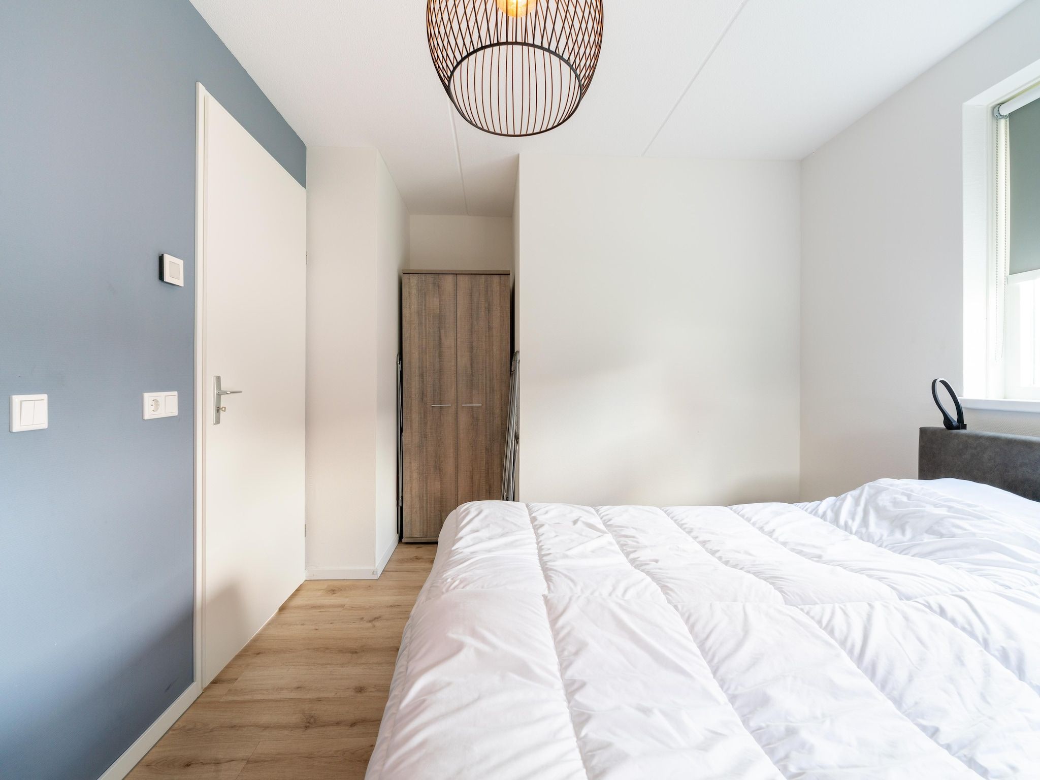 Een slaapkamer van De Kluut Huis Nr 12 in Scherpenisse