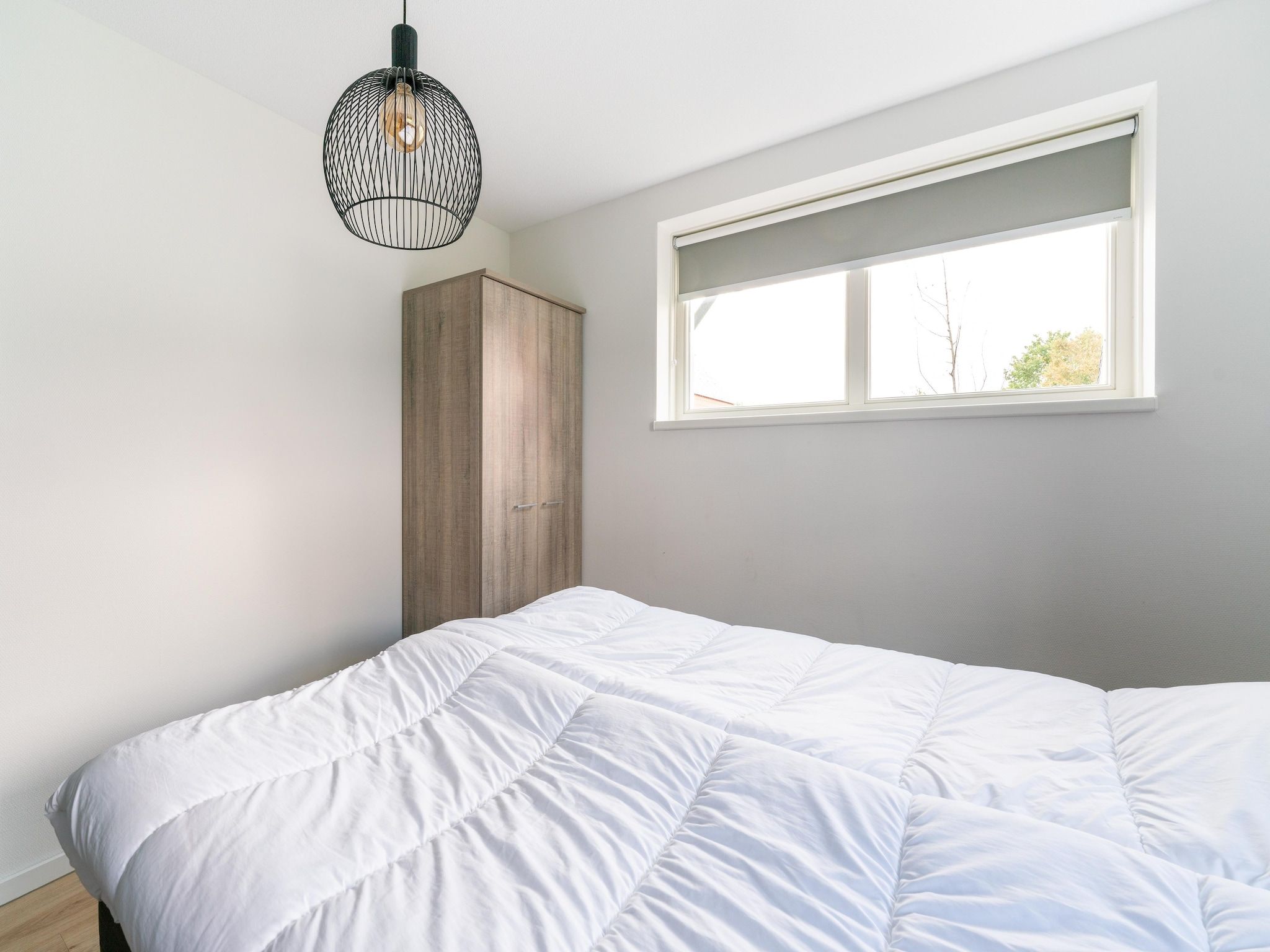 Een slaapkamer van De Kluut Huis Nr 12 in Scherpenisse