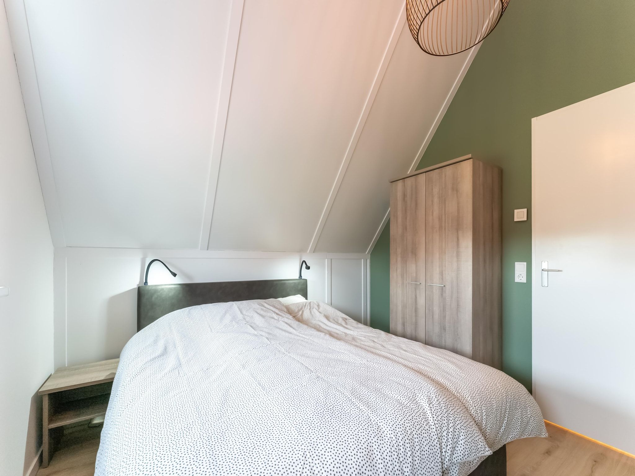 Een slaapkamer van De Reiger Huis Nr 46 in Scherpenisse