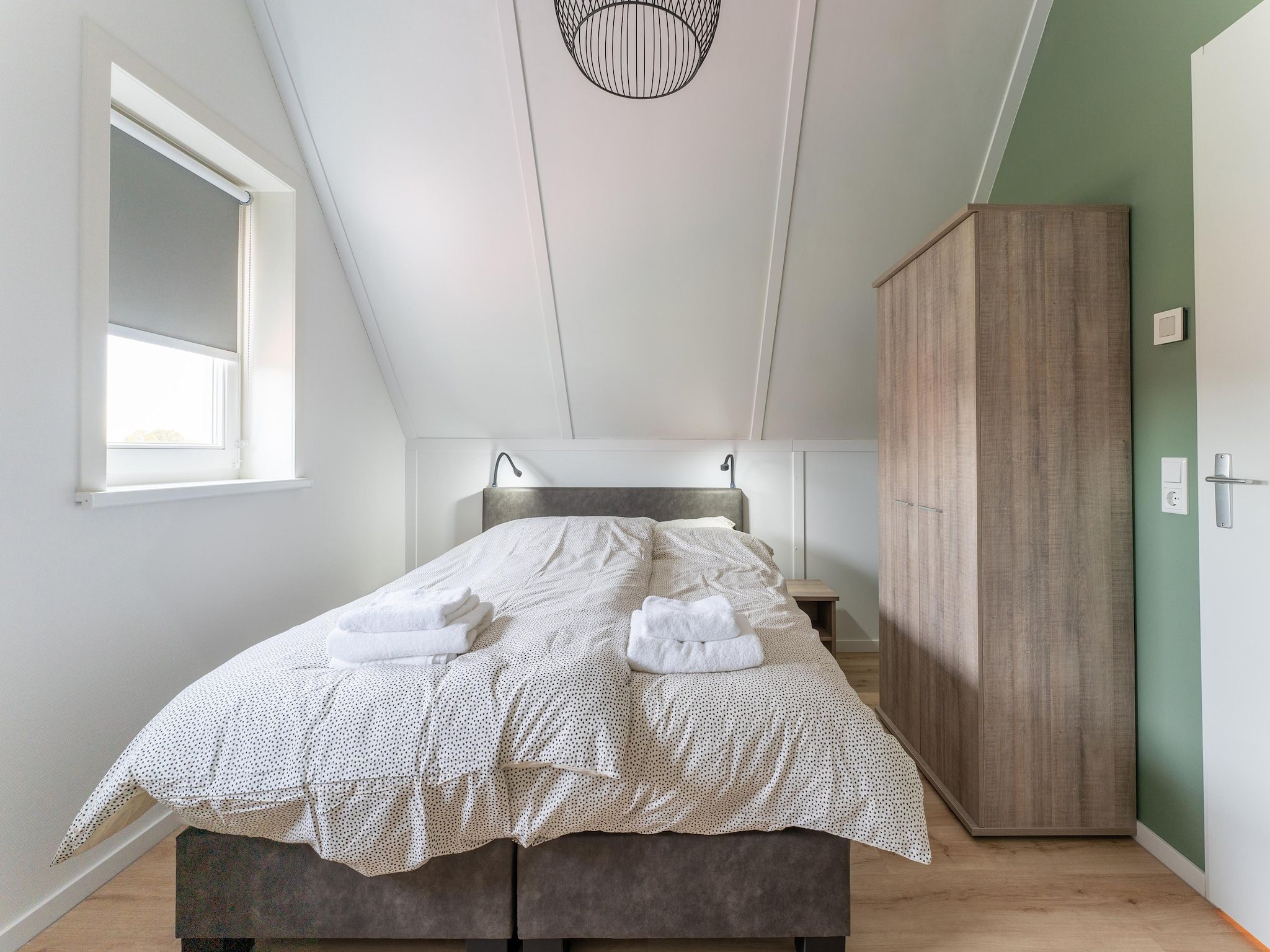 Een slaapkamer van De Reiger Huis Nr 46 in Scherpenisse